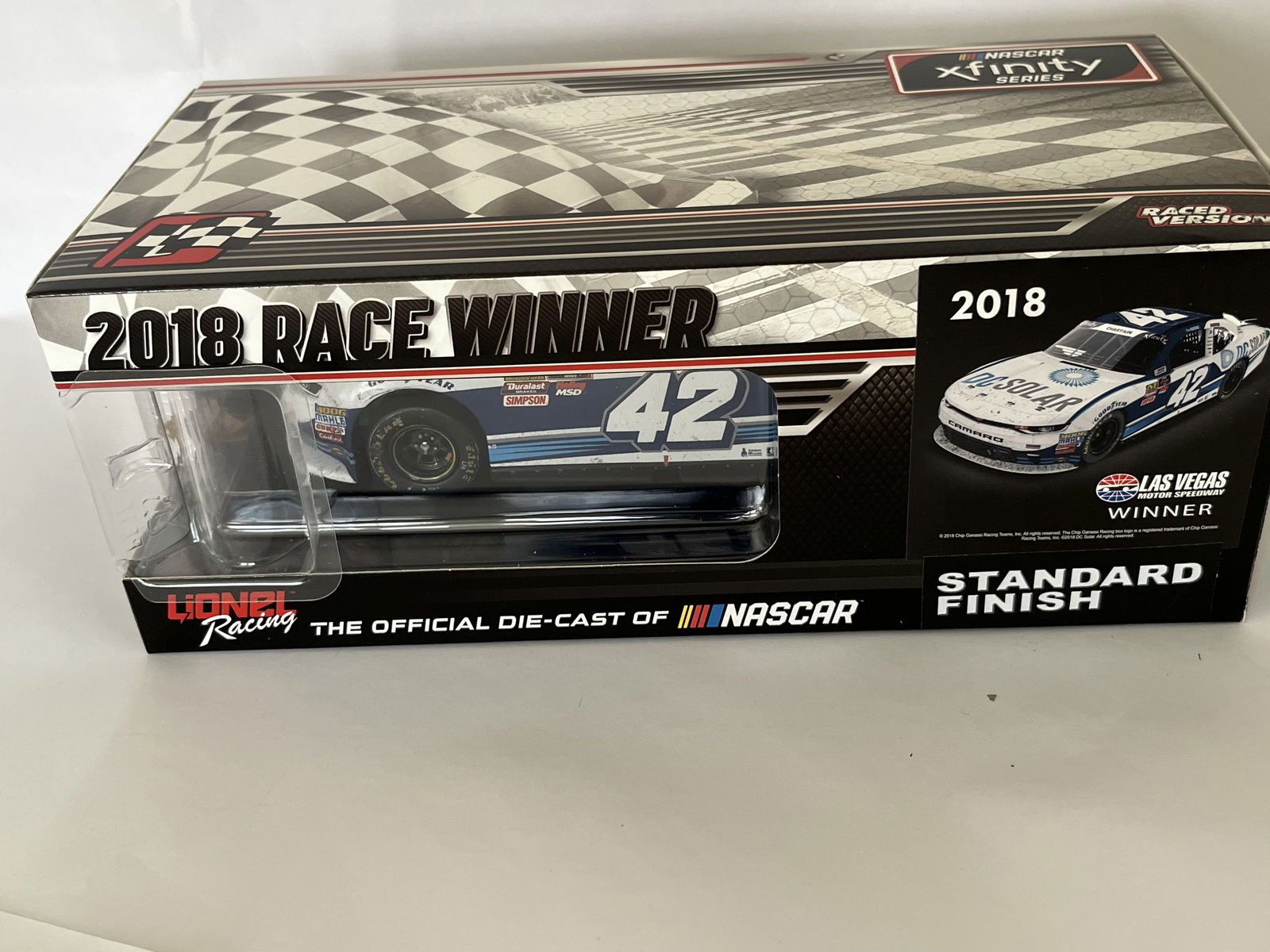 Lionel Racing Ross Chastain #42 DC Solar Las Vegas Win Autographed 2018 Camaro Die-Cast, 1 of 144: This is a 1:24 scale die-cast model car manufactured by Lionel Racing under the Action Racing Collectibles brand. The vehicle commemorates Ross Chastain's victory in the 2018 NASCAR Xfinity Series