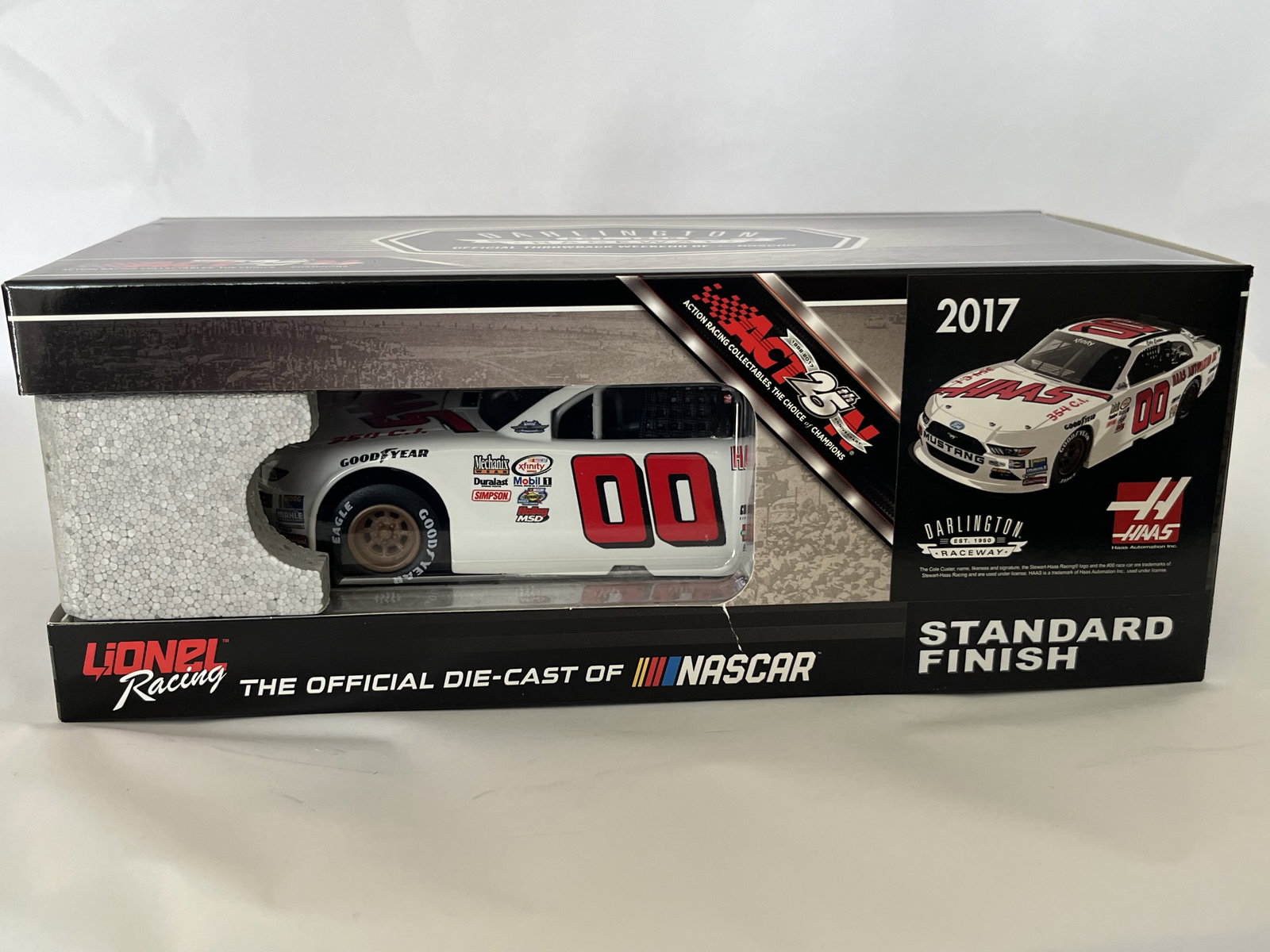Lionel Racing Cole Custer #00 Haas Automation 2017 Darlington Throwback Die-Cast Car, Autographed: This lot features a 1:24 scale die-cast model of Cole Custer’s #00 Haas Automation Ford Mustang, specifically the throwback scheme run at Darlington Raceway in 2017. Manufactured by Lionel Racing un
