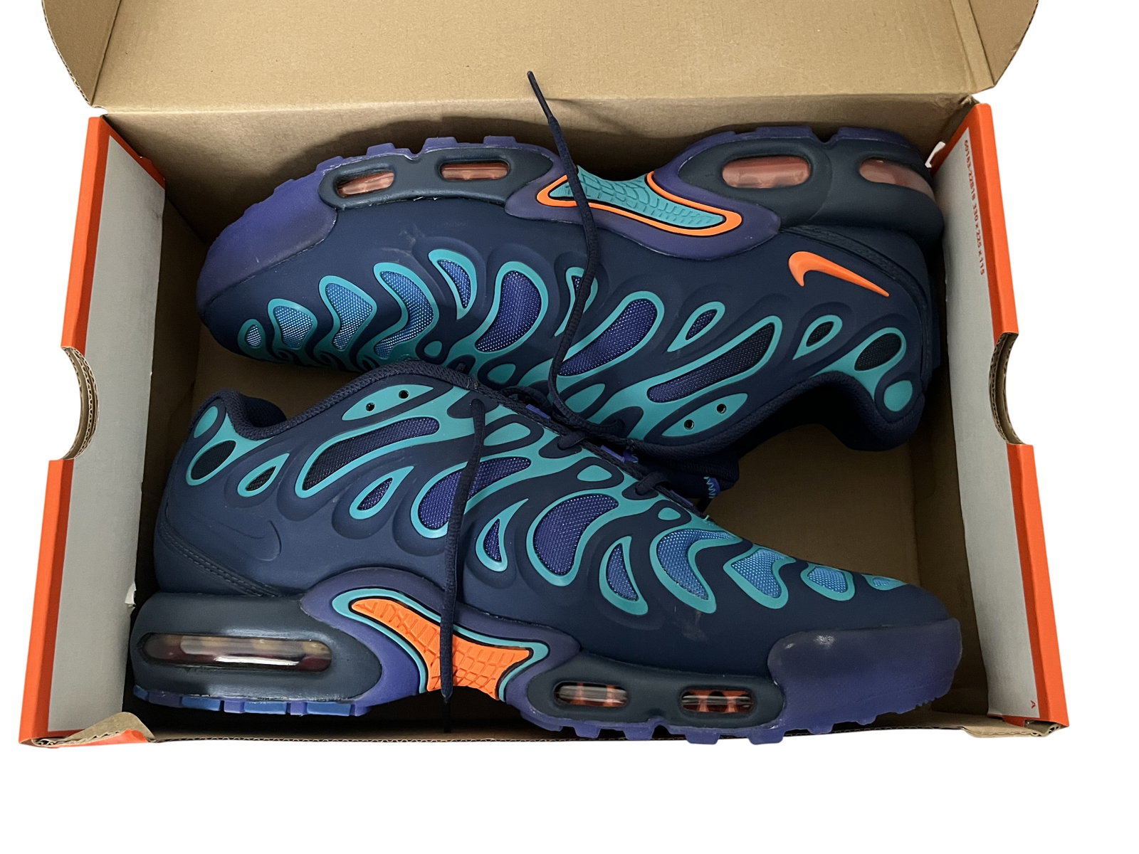 Nike Air Max Plus Drift Sneakers in Midnight Navy and Total Orange: Appear to have never been worn. A pair of Nike Air Max Plus Drift athletic sneakers featuring a Midnight Navy mesh upper reinforced by a signature wavy, molded TPU cage in a Dusty Cactus teal gradient