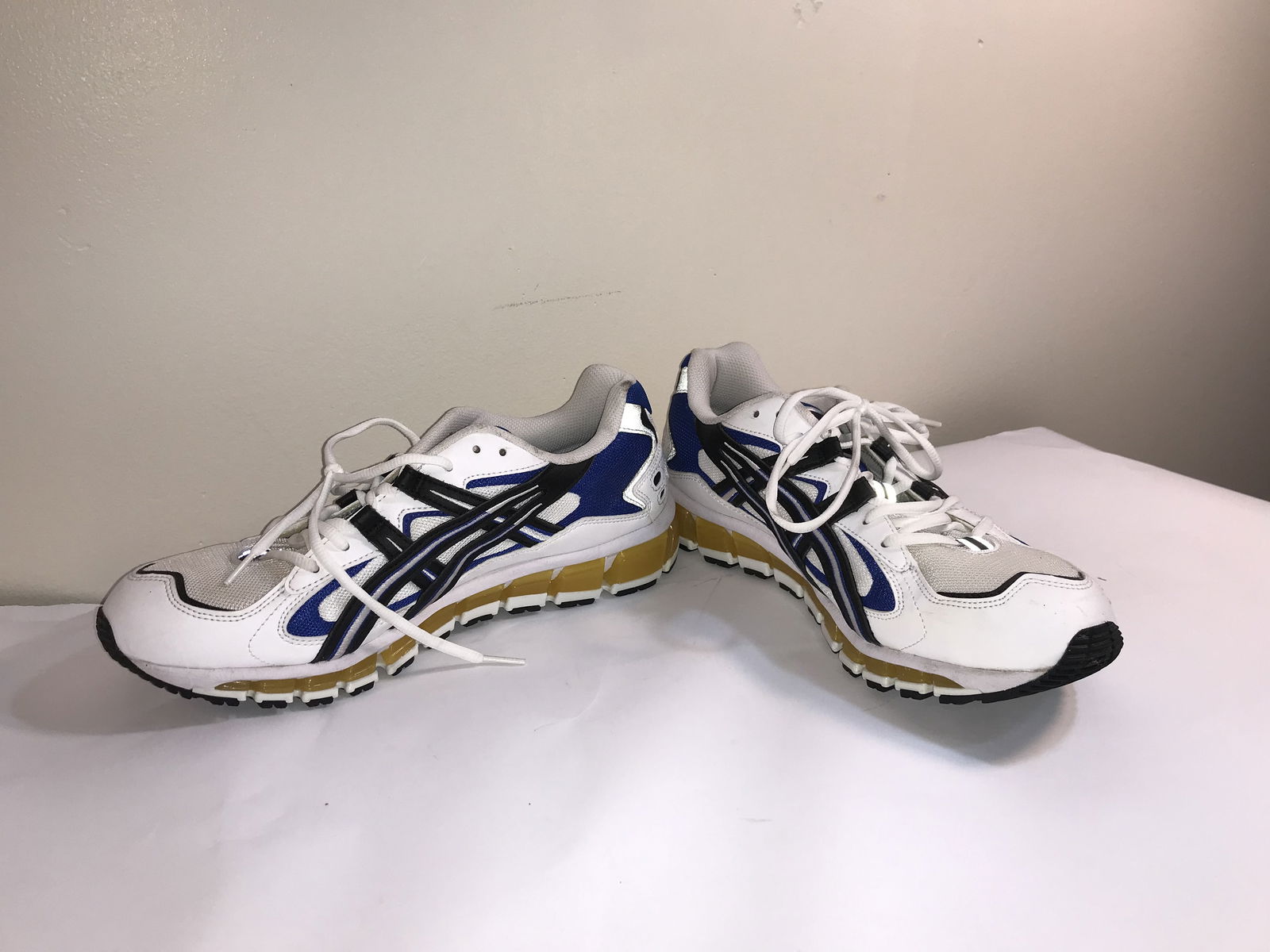 A Pair of ASICS Gel-Kayano 5 360 Athletic Running Shoes: This lot features a pair of ASICS Gel-Kayano 5 360 running shoes, a hybrid model that blends the heritage aesthetic of the 1990s Gel-Kayano 5 upper with modern GEL-Quantum 360 sole technology. The