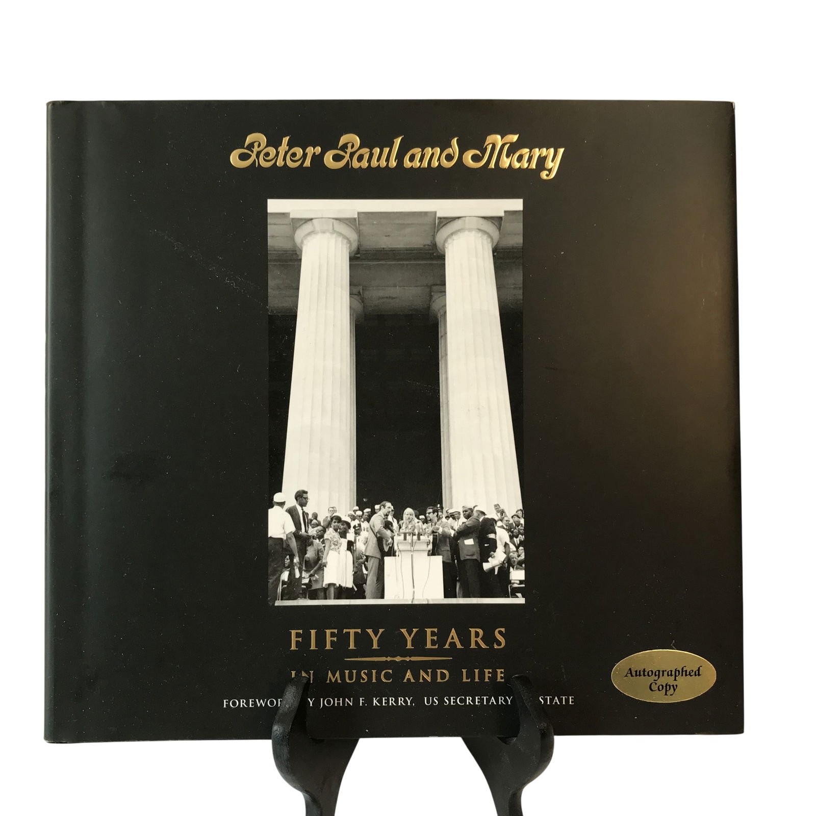 Peter Paul and Mary Fifty Years in Music and Life Autographed Hardcover Book: There are 2 hardcover volumes, titled Peter Paul and Mary: Fifty Years in Music and Life, one is an autographed copy and the other is not. The interior title page features two signatures in black