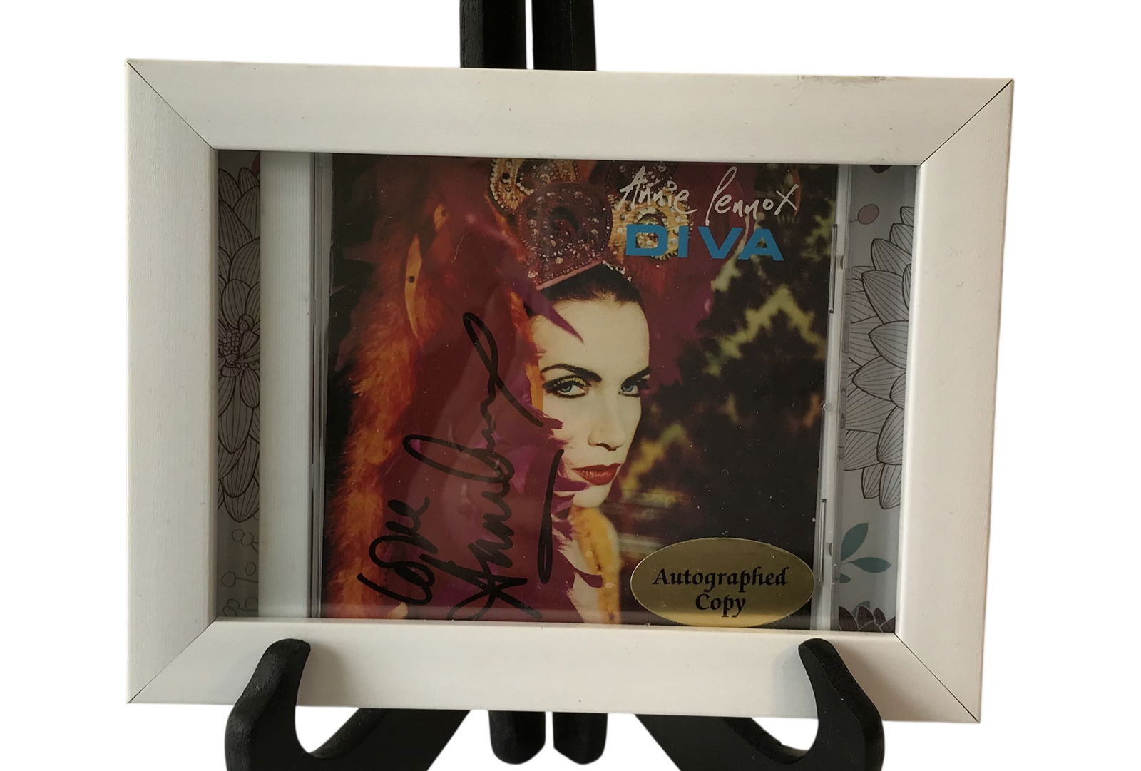 Annie Lennox Signed Diva CD Cover in Shadowbox Frame: This item is an autographed CD jewel case cover for the 1992 Annie Lennox album Diva.