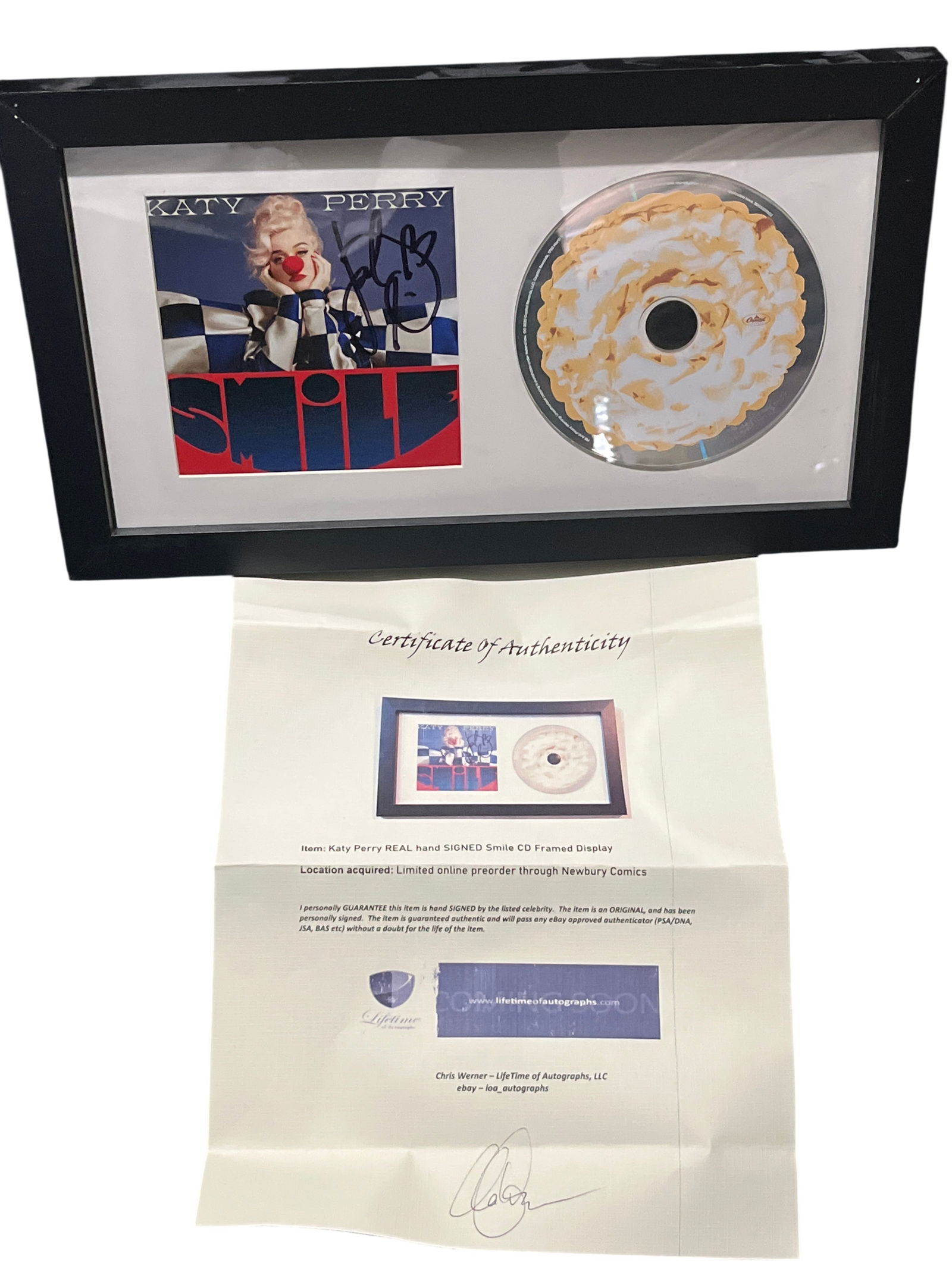 Katy Perry Signed Smile CD Album Framed Display with COA: Katy Perry Smile album framed memorabilia display, circa 2020. The set features a hand-signed album art card and a compact disc with a lemon meringue pie graphic, professionally mounted in a white mat