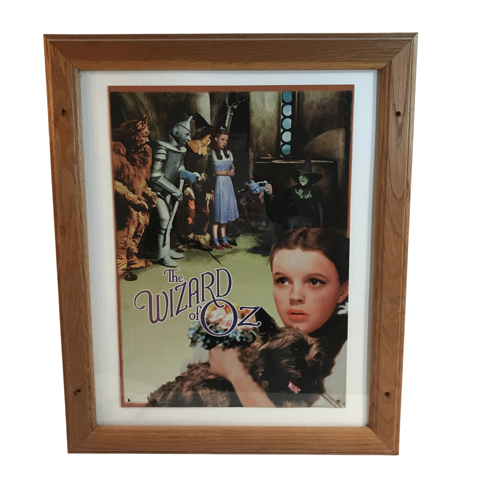 The Wizard of Oz Collectible Movie Print Framed Under Glass: This framed collectible print features a composite of iconic imagery from the 1939 Metro-Goldwyn-Mayer film, The Wizard of Oz. Frame measures 22 1/2 by 18 1/2 inches