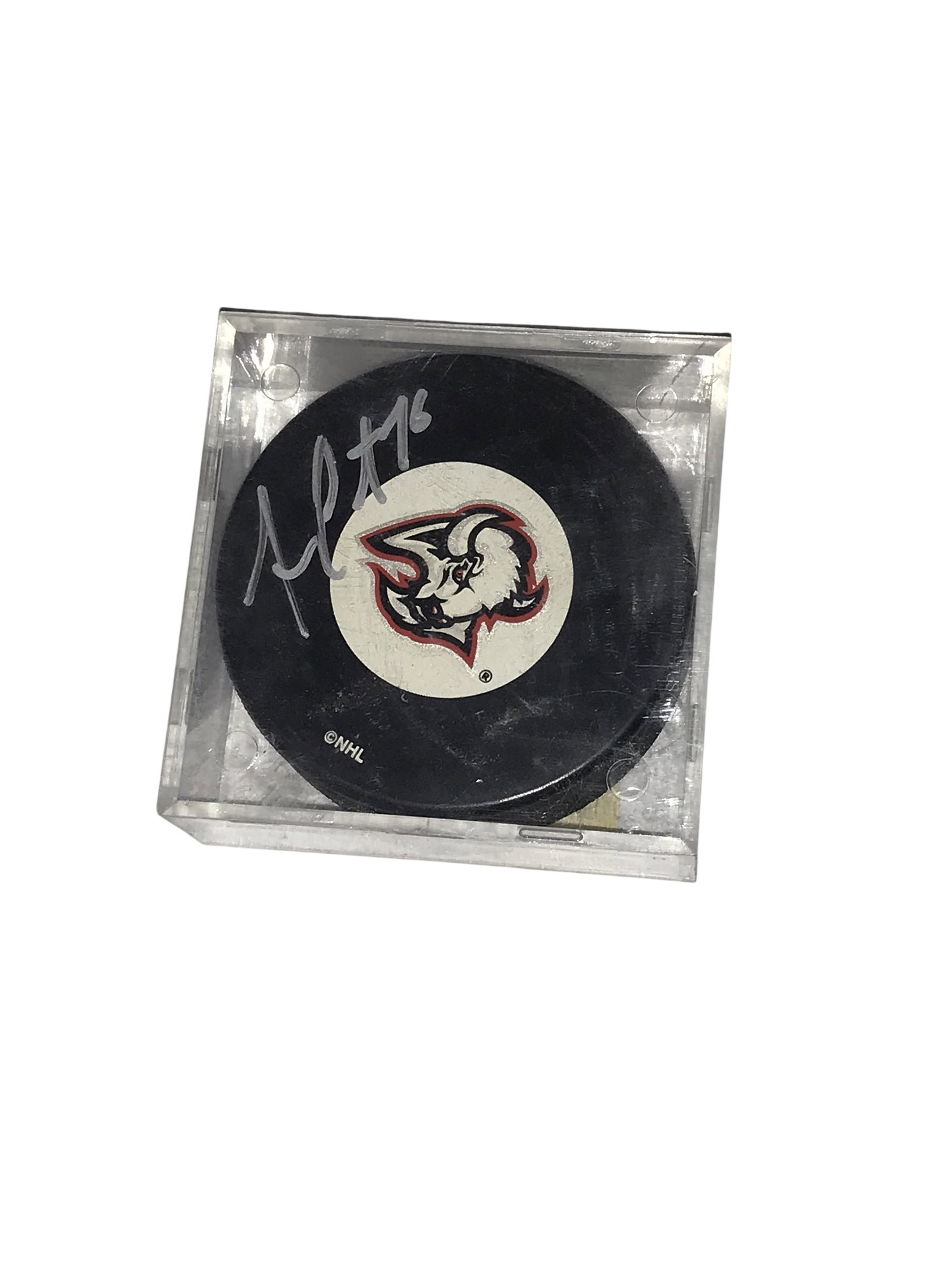 Andrew Peters Autographed Buffalo Sabres Hockey Puck: Official NHL licensed Buffalo Sabres hockey puck signed by Andrew Peters, circa 2004. The black puck features the team's Goathead primary logo on a central white decal and is signed in silver-tone ink
