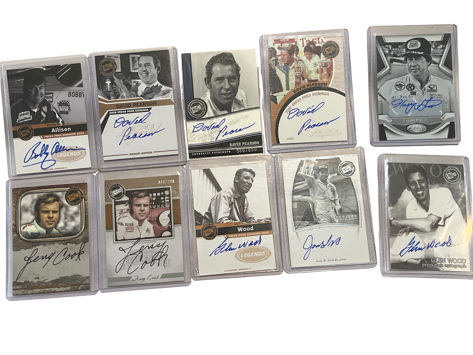 A Collection of Ten Autographed NASCAR Trading Cards Including Press Pass and Panini: Press Pass and Panini autographed NASCAR trading cards featuring various racing legends, circa 2006-2008. The collection includes on-card signatures from David Pearson, Bobby Allison, Harry Gant, Jerr