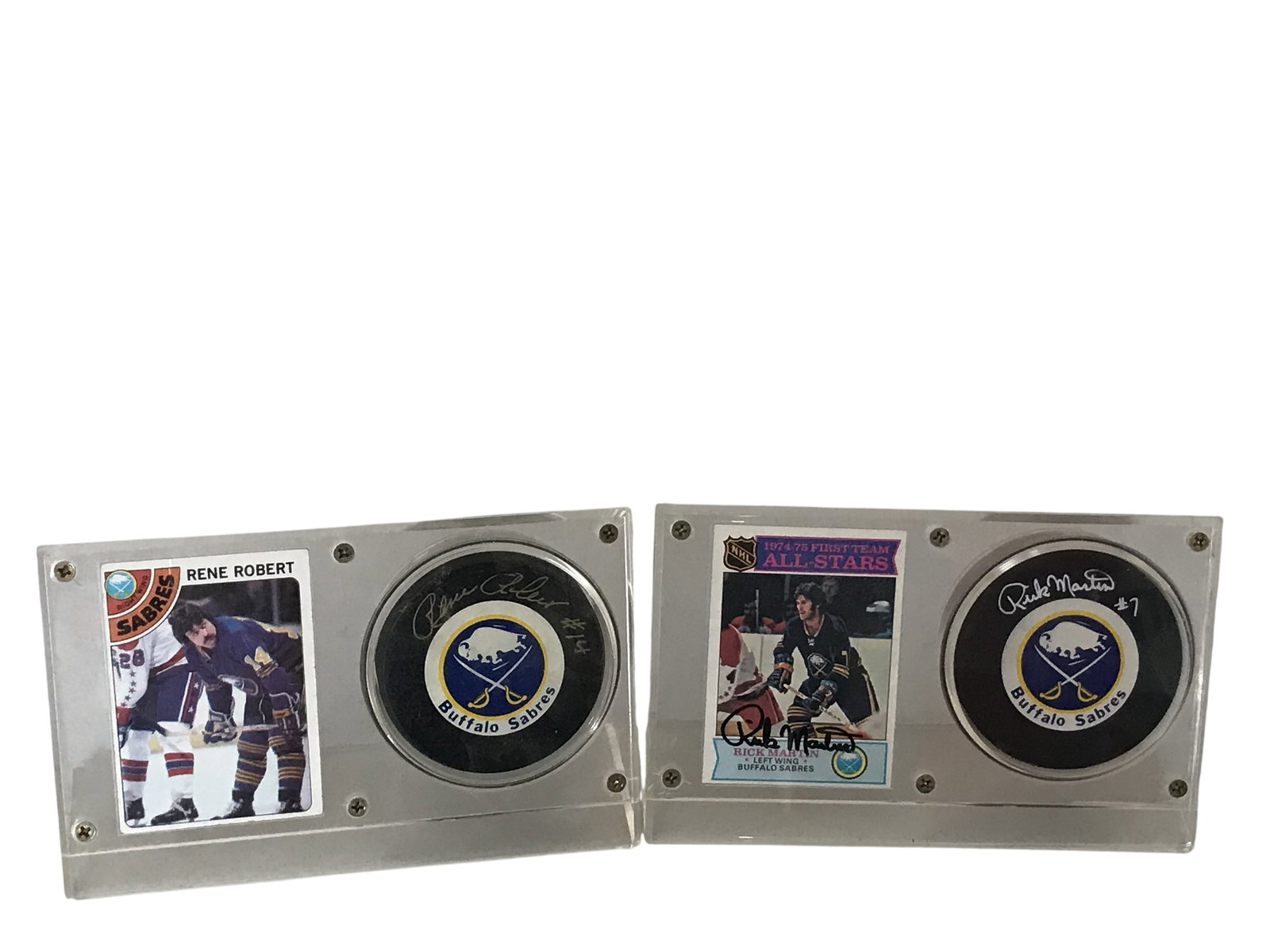 A Pair of Buffalo Sabres Autographed Puck and Trading Card Displays: Trench Mfg. Buffalo Sabres autographed puck and card displays, circa 1977-1992. This pair of memorabilia sets features hand-signed pucks and trading cards for French Connection members Rene Robert and