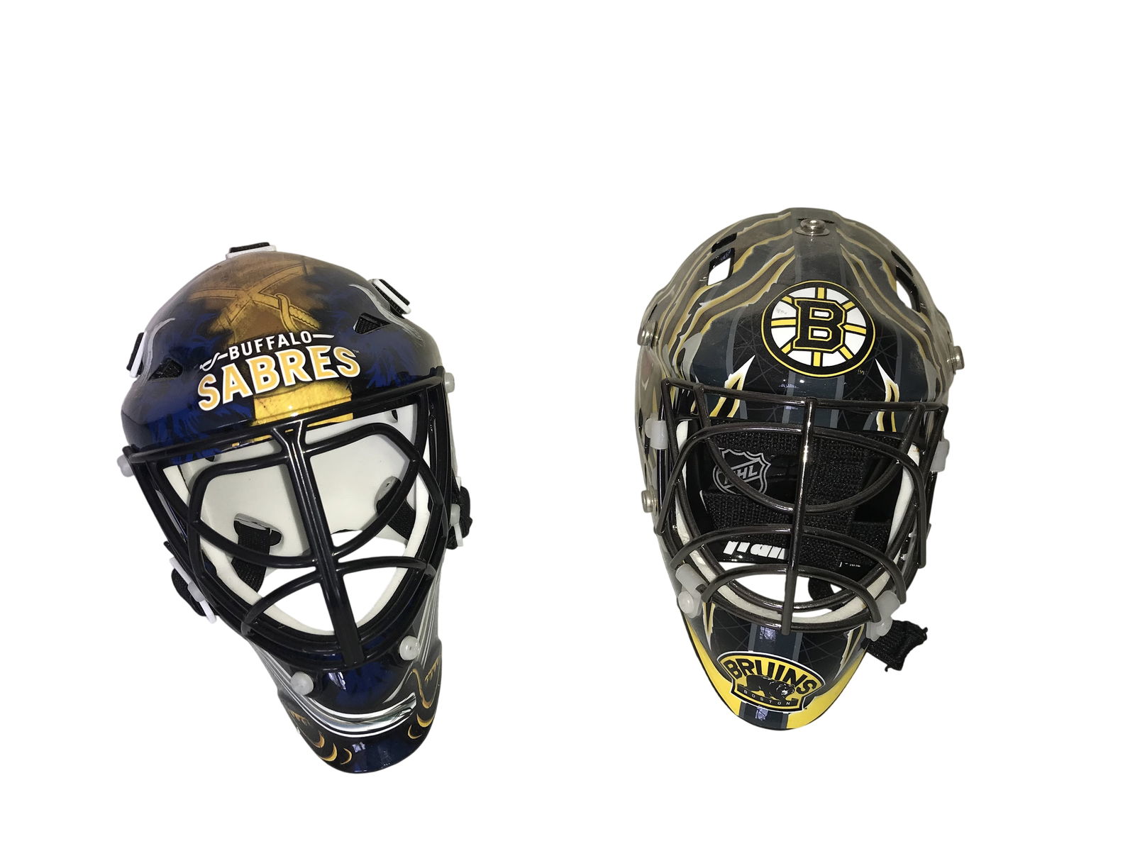 A Pair of Franklin Sports NHL Street Hockey Goalie Masks, Buffalo Sabres and Boston Bruins: Franklin Sports street hockey goalie masks featuring National Hockey League team branding, early 21st century. The masks are constructed of molded plastic shells with black metal wire cages, internal