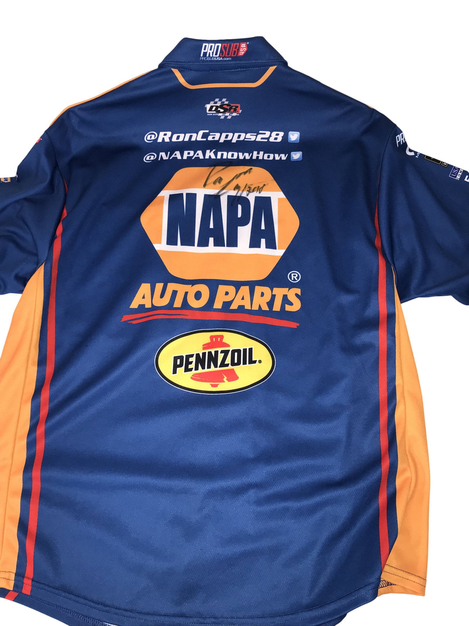 Ron Capps Don Schumacher Racing NHRA Signed Crew Shirt: ProSub NHRA Don Schumacher Racing crew shirt, circa 2018. The short-sleeved button-down is composed of blue and orange fabric with sublimated NAPA Auto Parts, Pennzoil, and DSR logos. The reverse feat