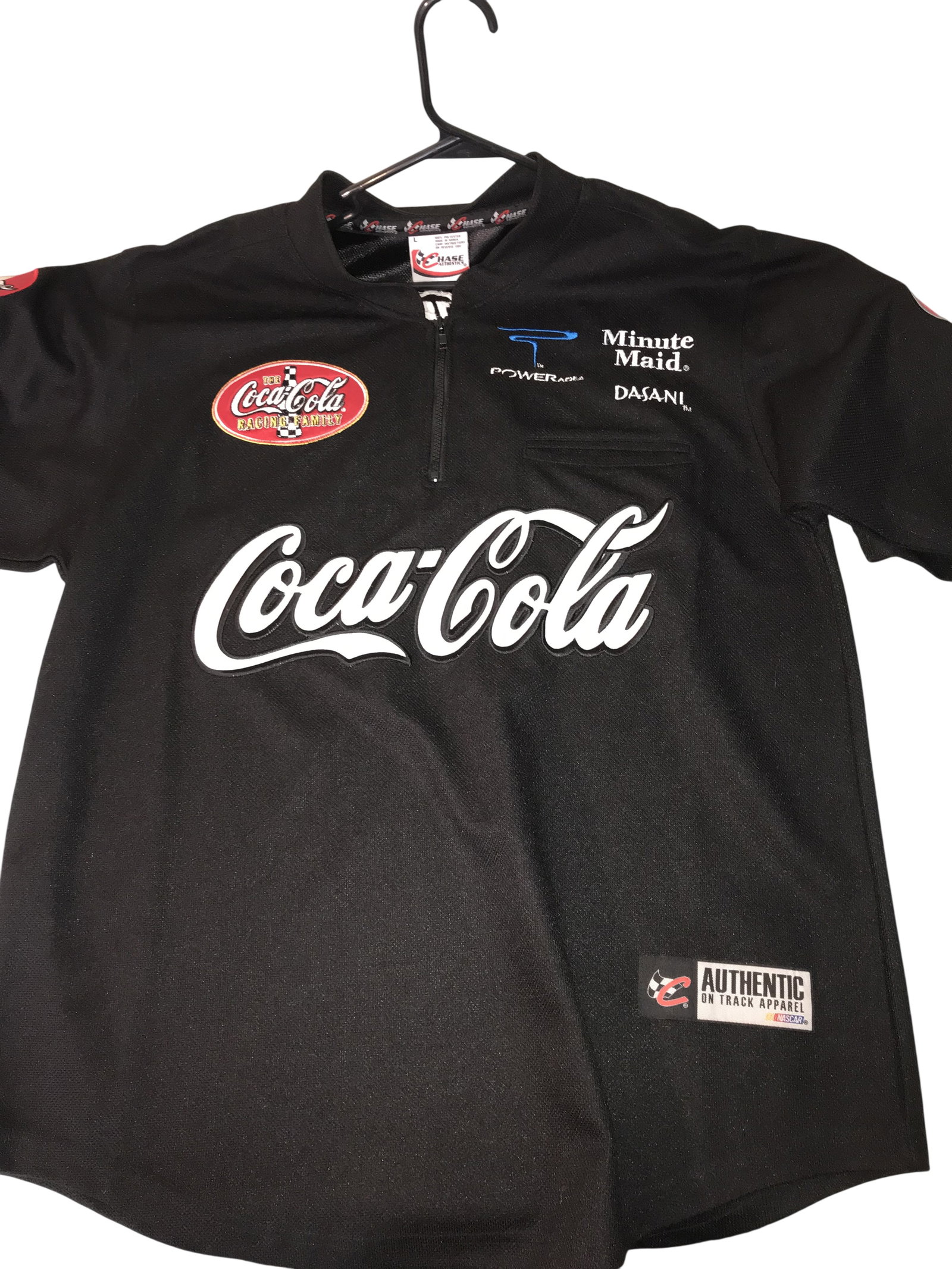 Chase Authentics NASCAR Coca-Cola Racing Family Quarter-Zip Pit Shirt, Size Large: Chase Authentics NASCAR quarter-zip short-sleeve pit shirt from the early 2000s Coca-Cola Racing Family collection. Constructed from black 100% polyester, the garment features embroidered Coca-Cola, M