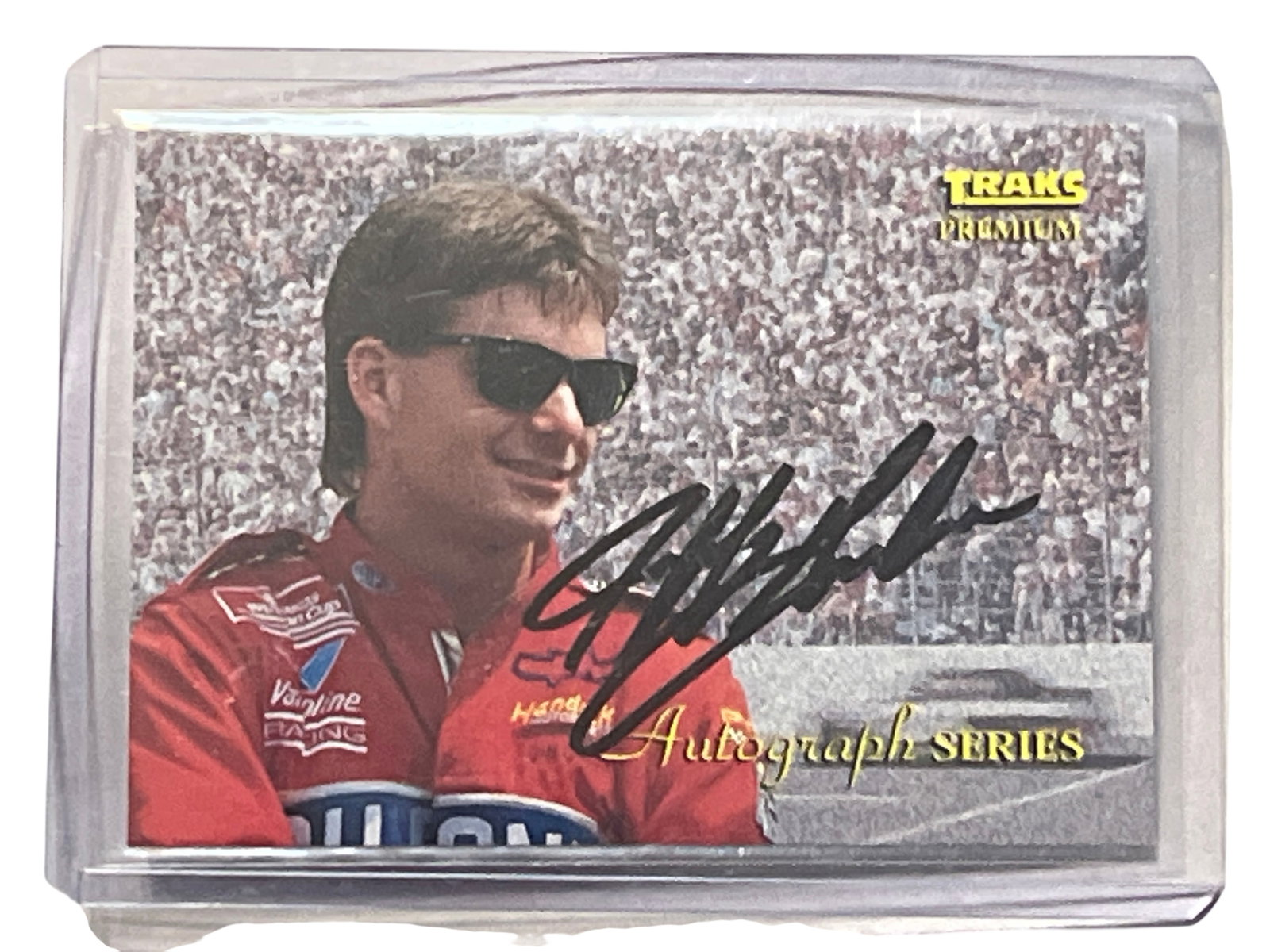 1994 Traks Premium Jeff Gordon Autograph Series Card A-4: 1994 Traks Premium Jeff Gordon racing trading card, number A-4 from the Autograph Series. The card features an authentic on-card signature in black ink over a photographic image of the driver. The rev