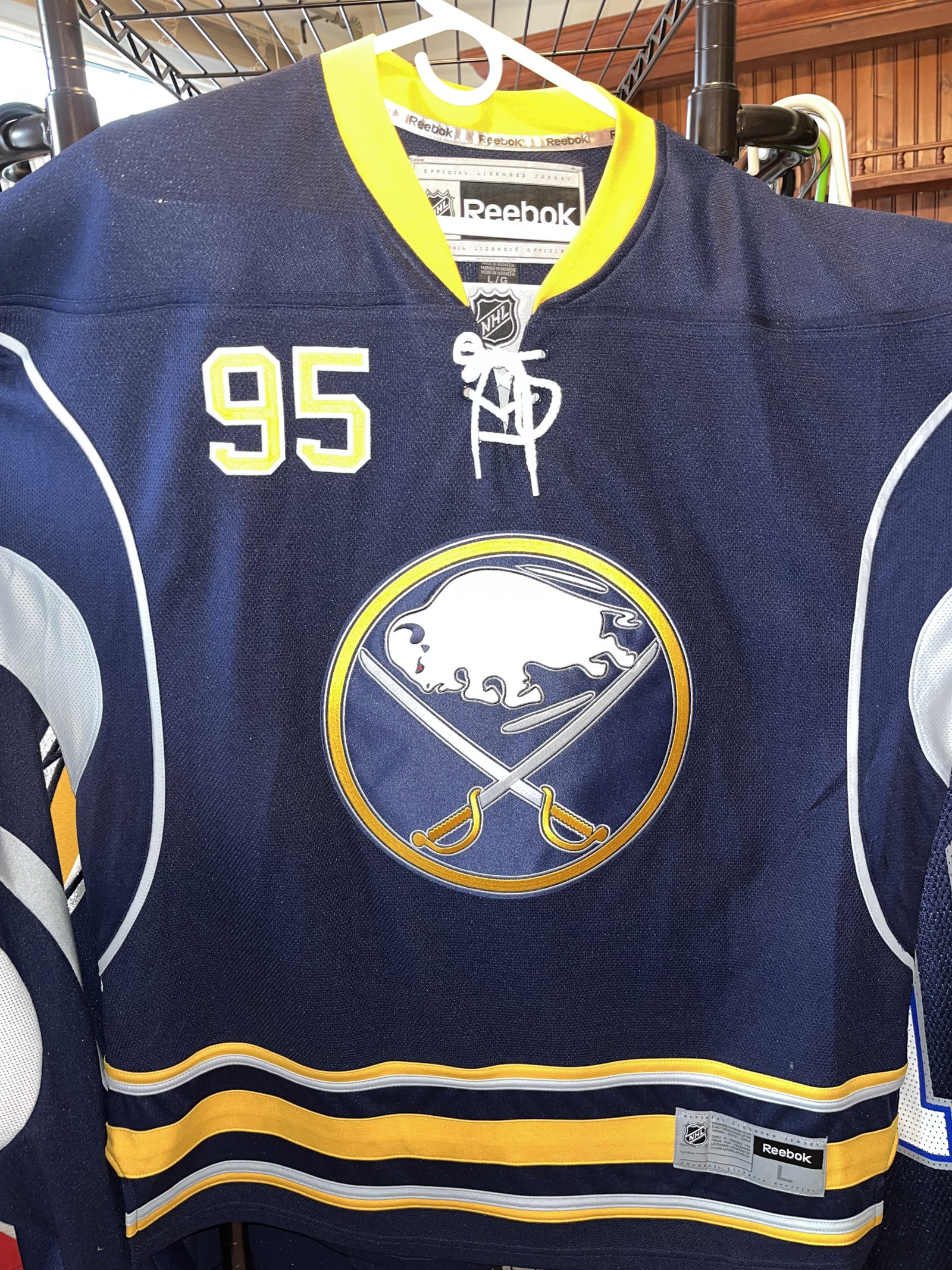 Signed Justin Bailey Buffalo Sabres Reebok Premier Home Jersey Size Large: Black ink signature and inscription 95 are located on the back within the digit 5. A blue hologram sticker from Dave and Adam's Card World with serial number DA 40833 is affixed to the back number for