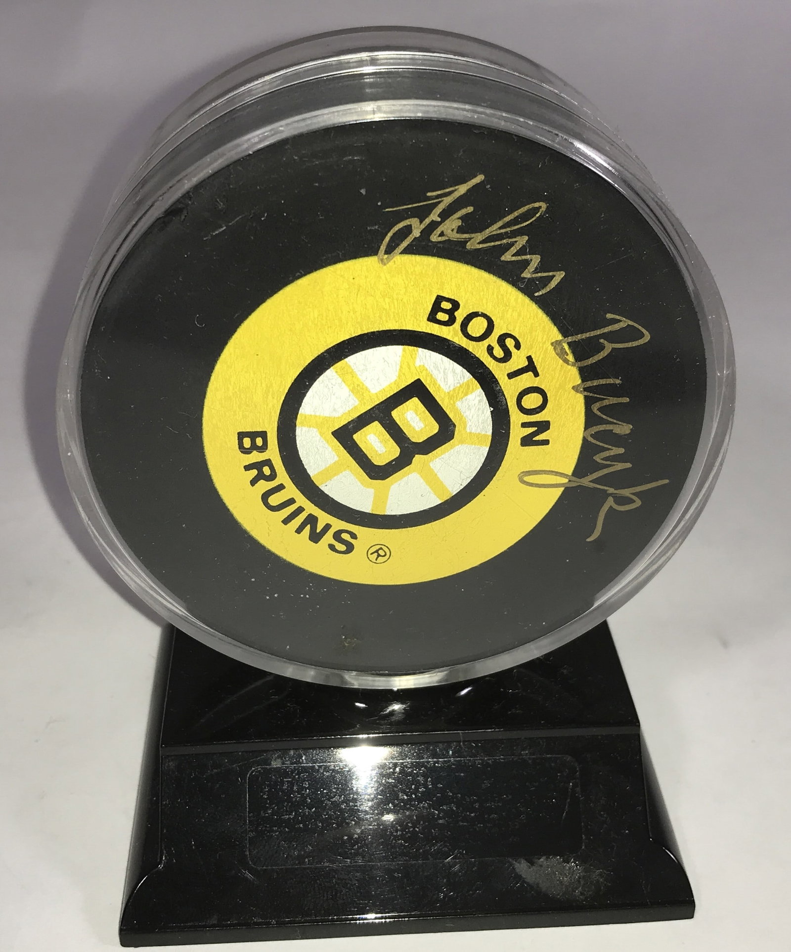 Autographed Boston Bruins Puck: Appears to be Johnny Bucyk, No COA