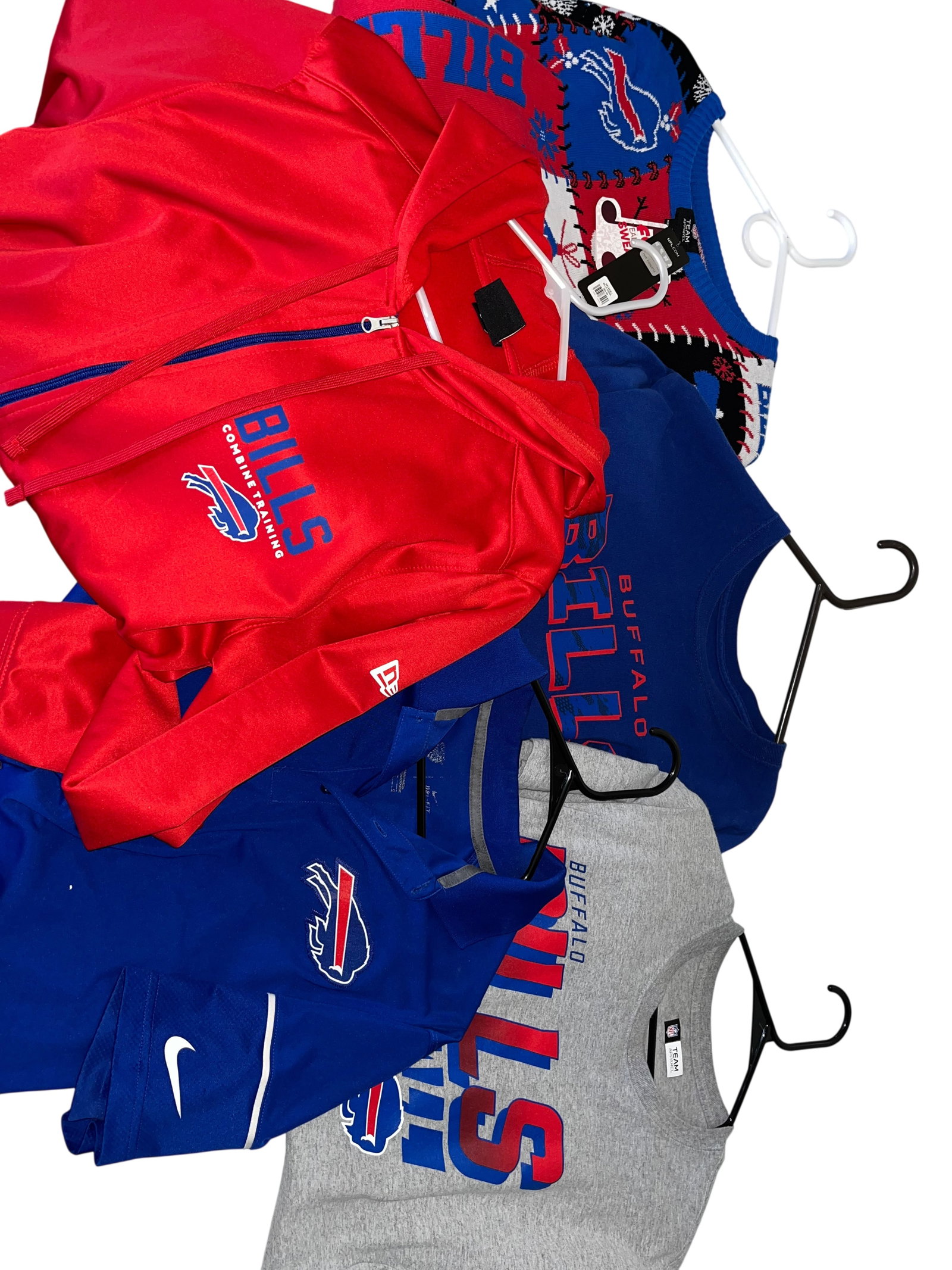 Buffalo Bills Fan Apparel and Athletic Wear Collection, Retail Lot: This lot features a diverse collection of Buffalo Bills (NFL) fan apparel and performance wear. The assortment includes a red New Era full-zip hoodie from the Combine Training line with blue zipper an