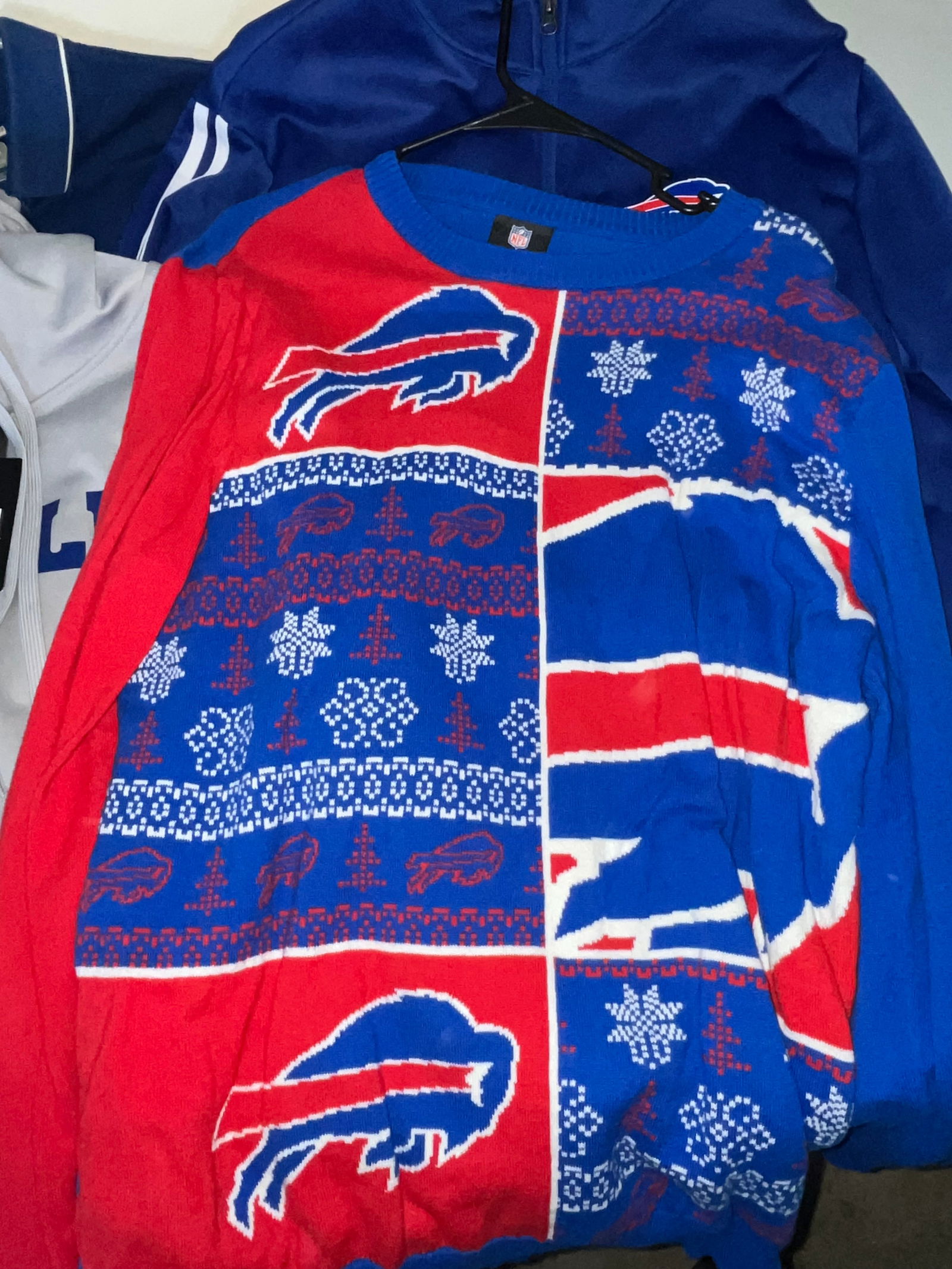 Buffalo Bills Licensed Apparel Collection Featuring New Era and Cutter & Buck: This lot consists of a diverse collection of Buffalo Bills (NFL) fan apparel, featuring official league and brand-name merchandise. The collection includes a New Era "Combine Authentic" long-sleeve ho