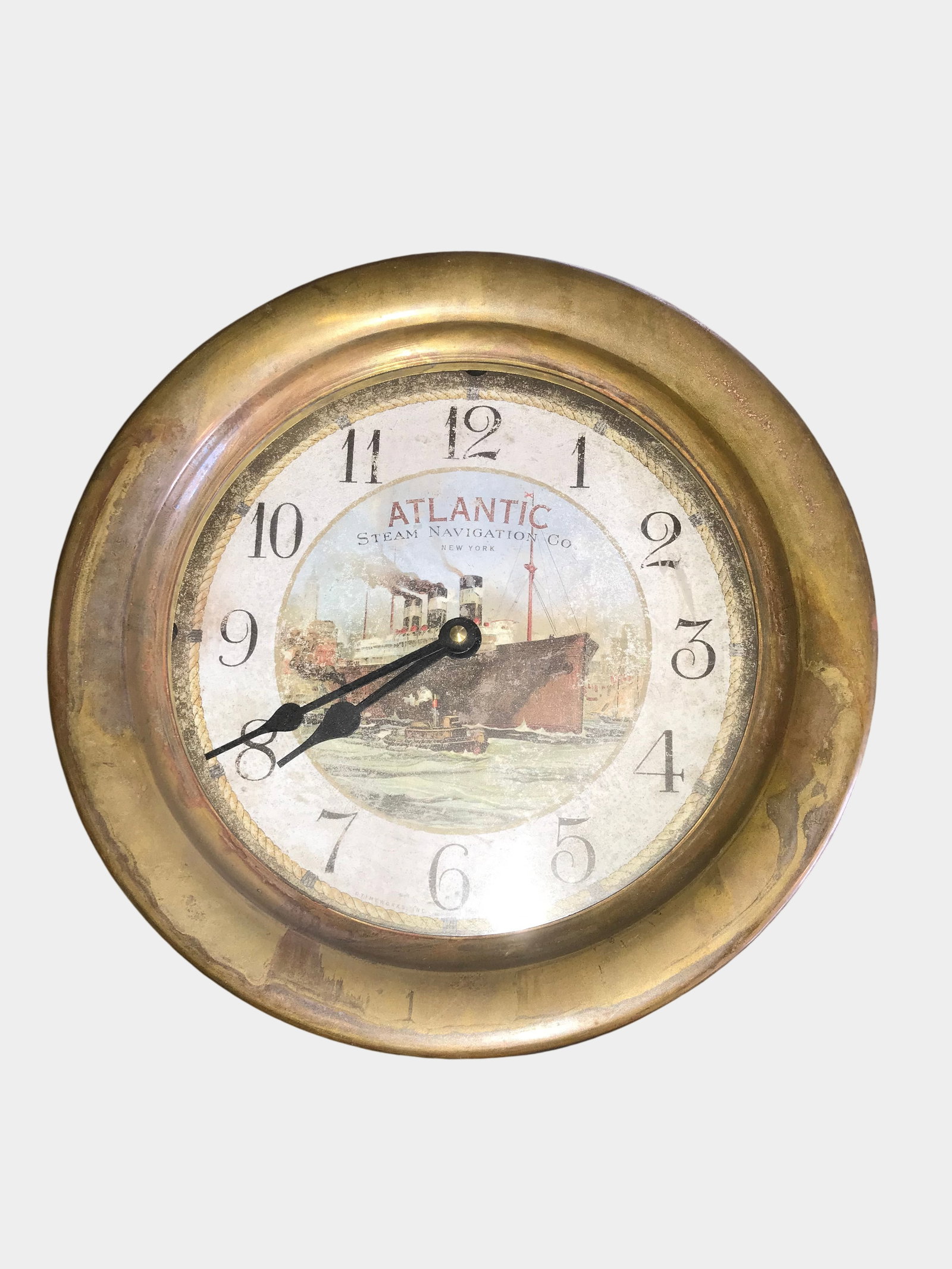 Timeworks Inc. Atlantic Steam Navigation Co. Maritime Style Wall Clock: Contemporary wall clock manufactured by Timeworks, Inc. of Berkeley, California, designed with a vintage maritime aesthetic. The circular metal case features a deep, antiqued patina intended to