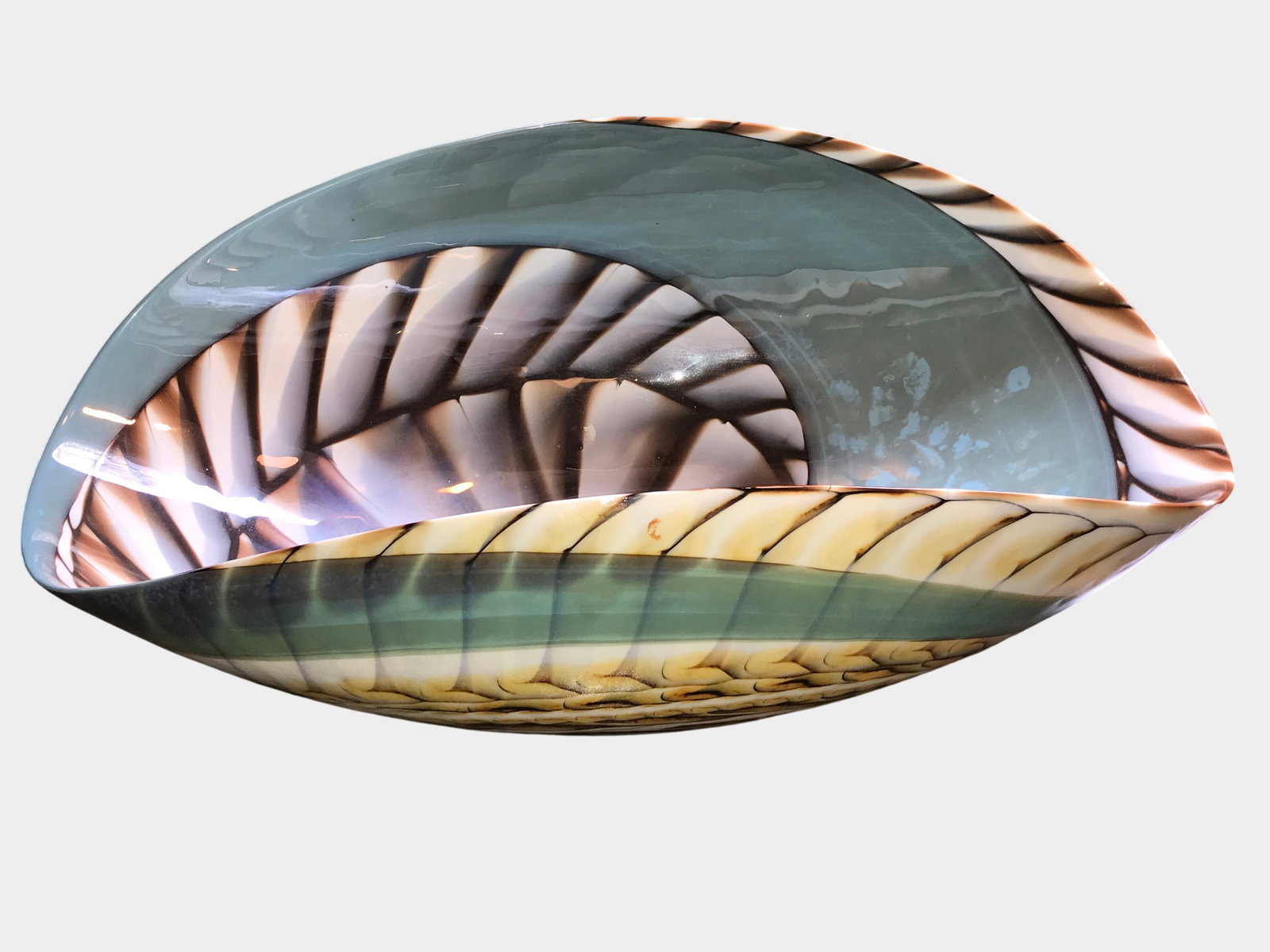 Murano Style Hand-Blown Art Glass Folded Bowl: Hand-blown art glass vessel features an asymmetrical, folded form in the style of Murano glassmakers. The exterior is decorated with horizontal bands of pulled-feather or scale-like patterns in cream