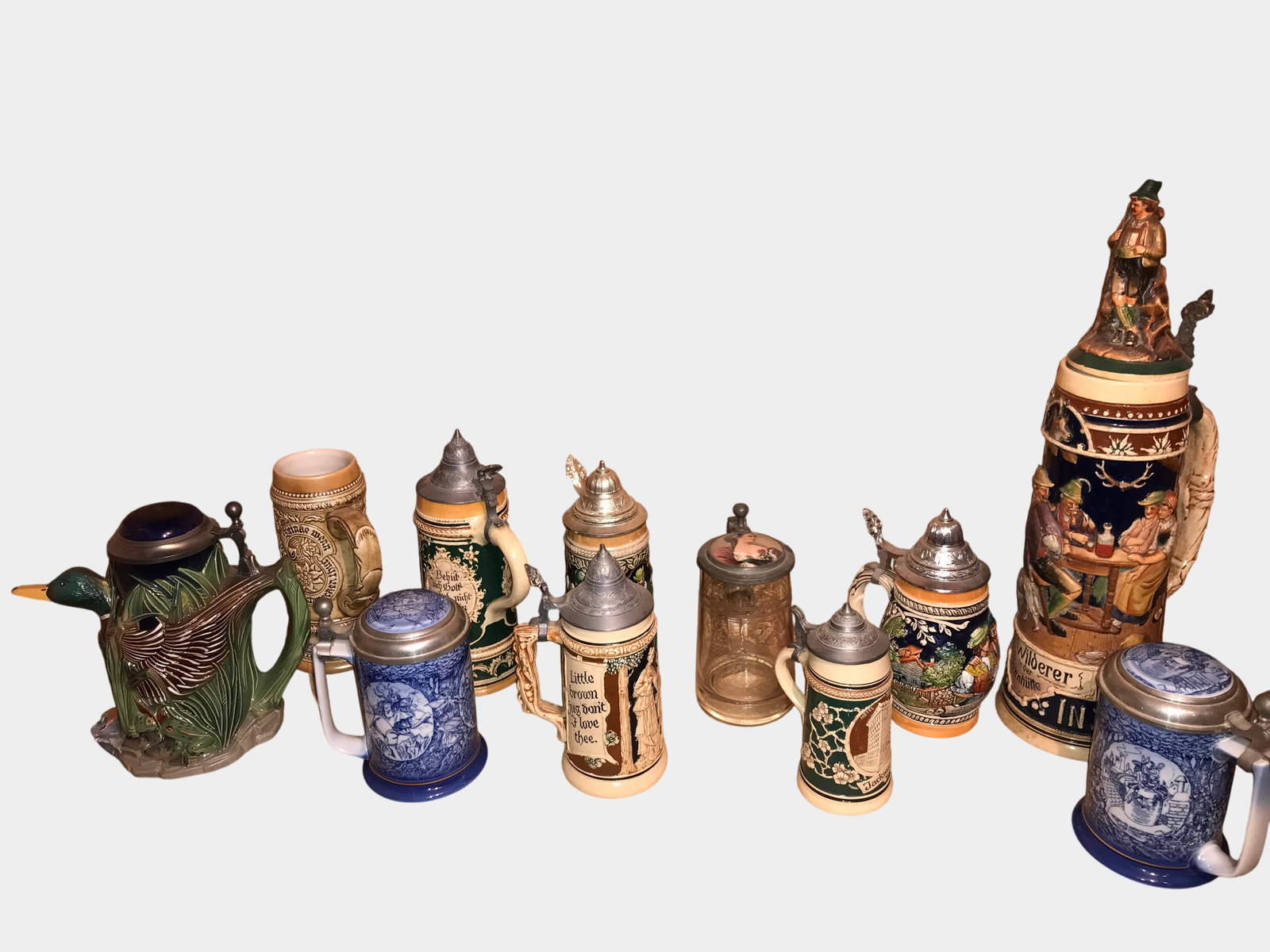 A Collection of Twelve Assorted German Style Beer Steins and Figural Pitcher (1 of 6)
