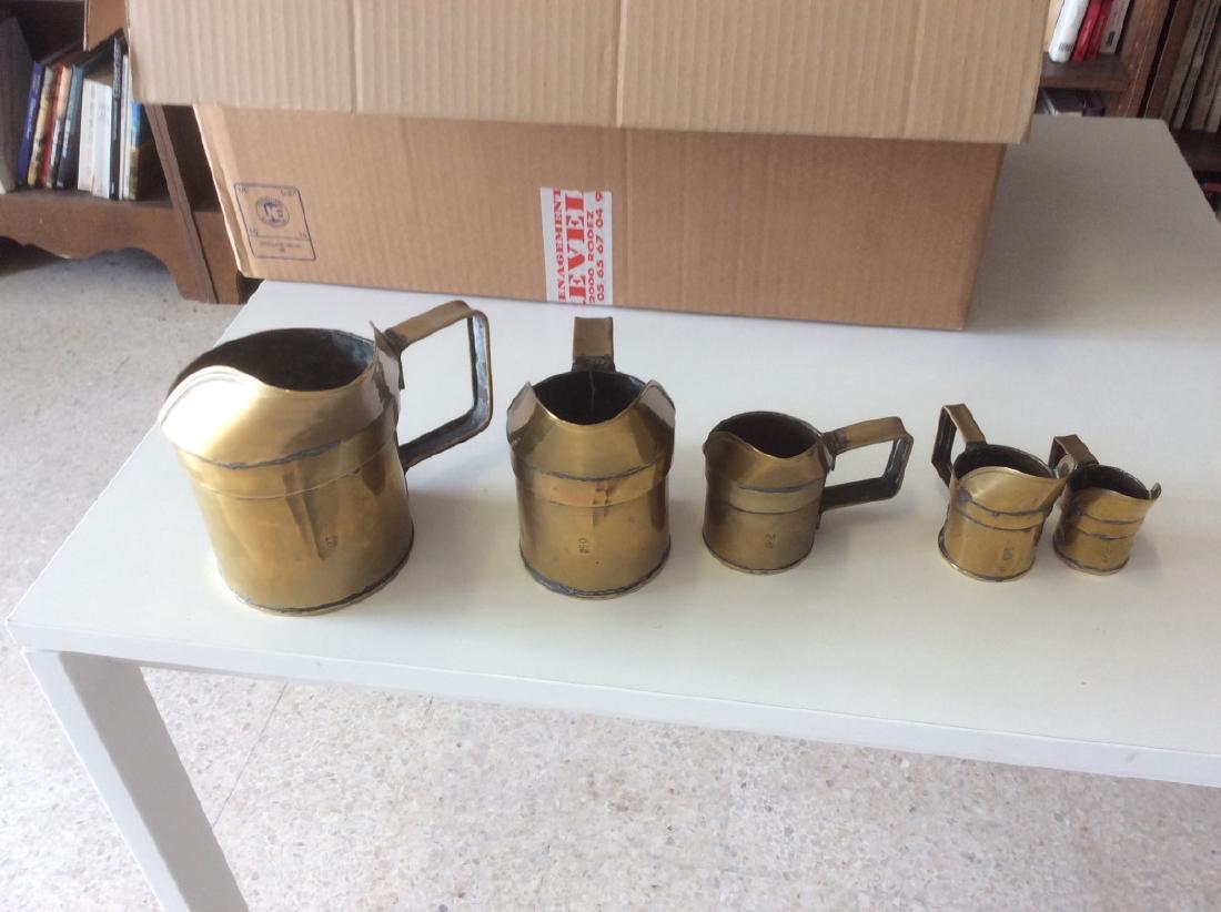 GRADUATING SET OF 5 EUROPEAN BRASS MEASURING PITCHERS (1 of 1)