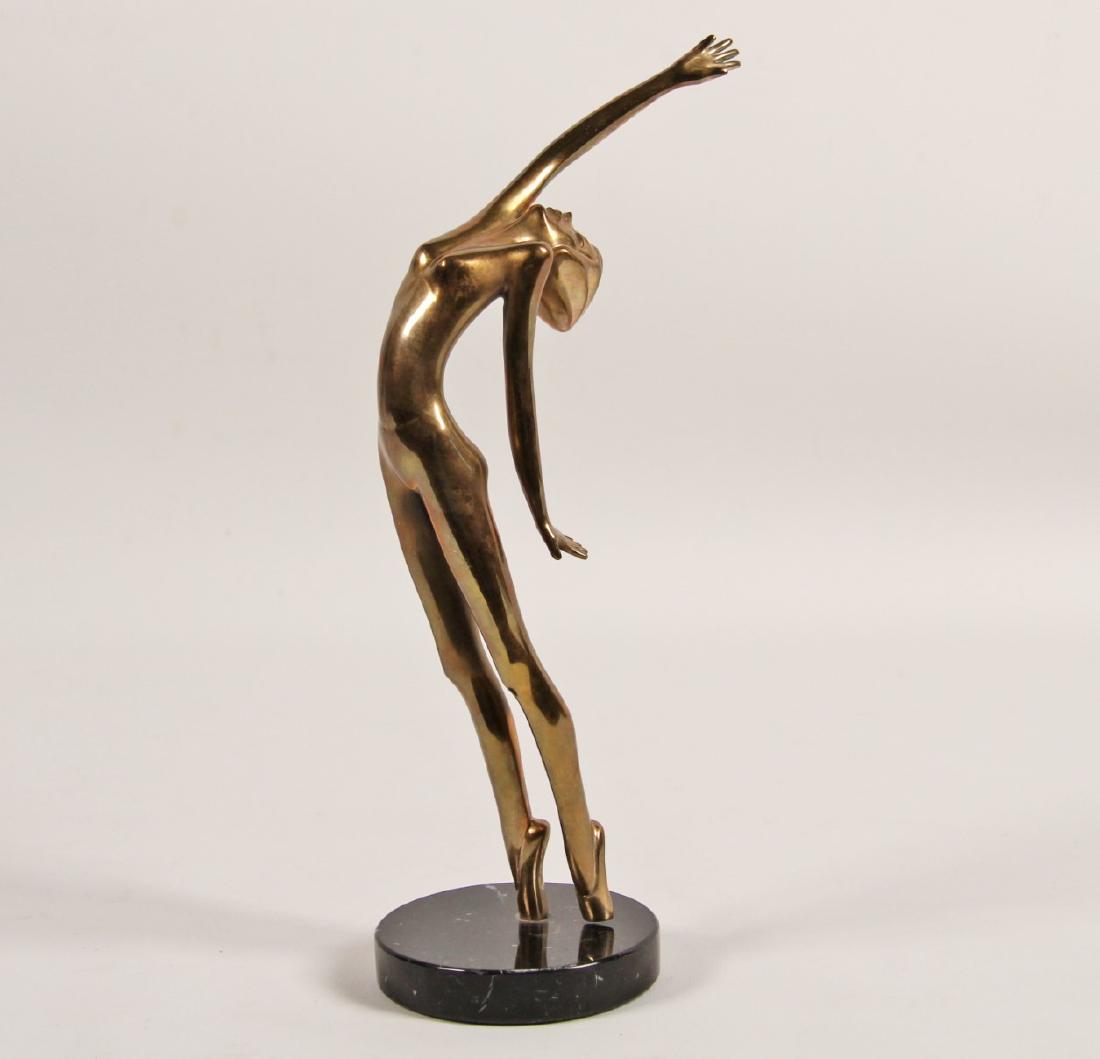 CELESTE BY TOM BENNETT (AMERICAN, 20TH CENTURY): CELESTE BY TOM BENNETT (AMERICAN, 20TH CENTURY). GILDED BRONZE FIGURE OF FEMALE NUDE POISED WITH OUTSTRETCHED HAND TITLED "CELESTE" BY TOM BENNETT, CALIFORNIA, SIGNED AND NUMBERED 172/500 ON FOOT, ALO