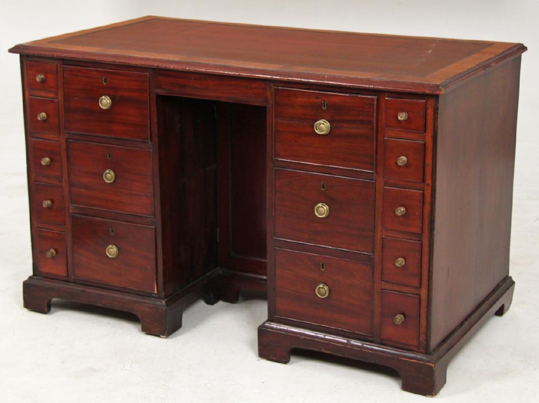 GEORGIAN MAHOGANY ARCHITECT'S KNEEHOLE DESK: GEORGIAN MAHOGANY ARCHITECT'S KNEEHOLE DESK WITH BURGUNDY LEATHER TOP; 31"H X 49"W X 27"D; CONDITION: SCUFFS TO LEATHER