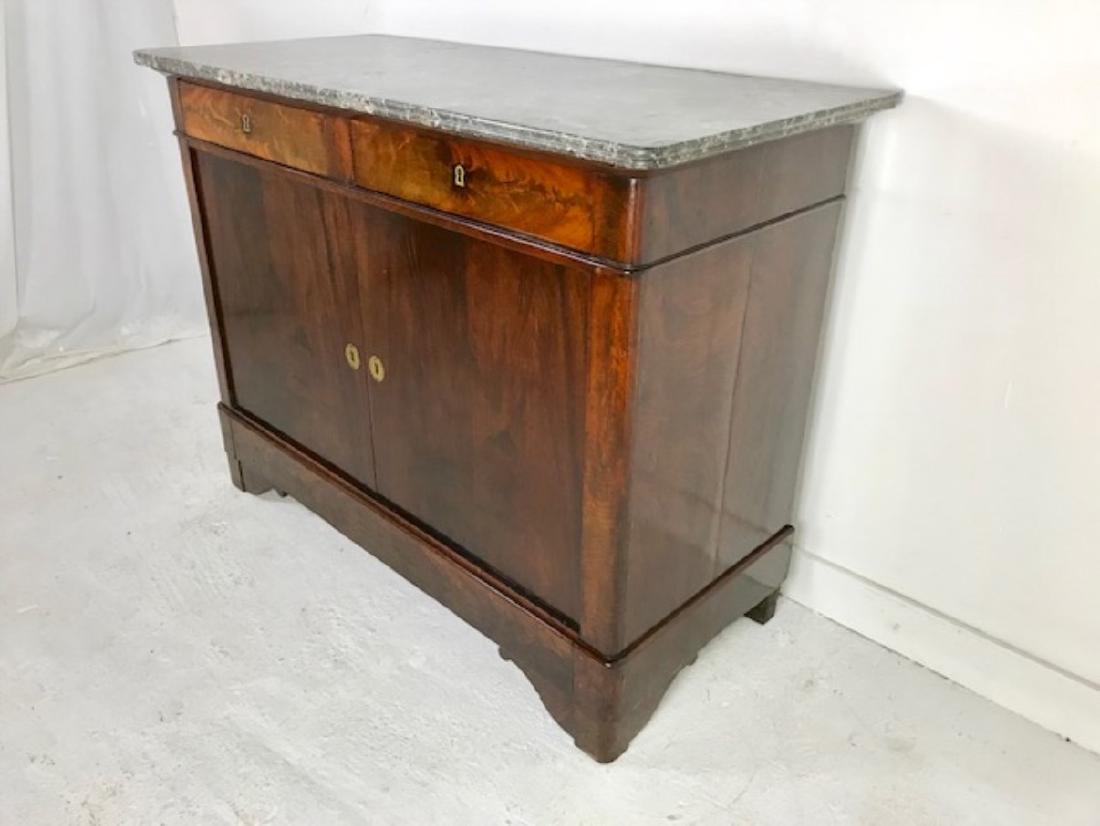 LOUIS PHILIPPE MAHOGANY M/TOP COMMODE: LOUIS PHILIPPE MAHOGANY COMMODE HAVING GREY AND WHITE VEINED GRANITE TOP OVER TWO DRAWERS AND TWO CUPBOARD DOORS RESTING ON MOLDED PLINTH AND SPLAT BRACKET FEET, 19TH C.; 38"H X 46"W X 23"D