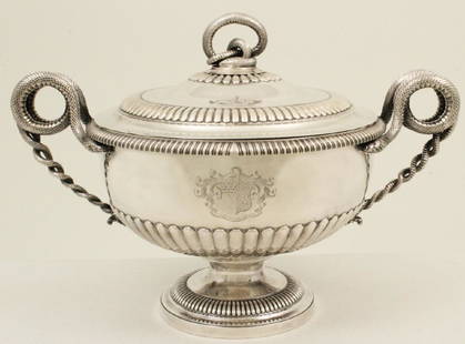 GEORGE III SILVER TUREEN, BURWASH AND SIBLEY, LONDON,: A FINE GEORGE III REPOUSSE SILVER TUREEN WITH COILED SERPENT HANDLES, HEAVILY GADROONED ACROSS LID, BODY, AND FOOT. ENGRAVED AMORIAL CREST READING SUB CRUCIE CANDIDA (UNDER THE WHITE CROSS) FITTED INT