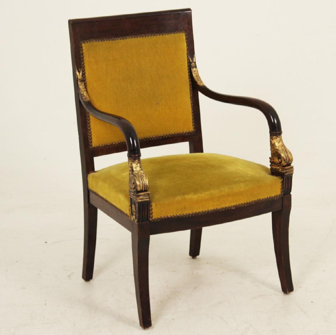 FRENCH RESTORATION STYLE MAHOGANY FAUTEUIL: FRENCH RESTORATION STYLE MAHOGANY FAUTEUIL WITH GILT HIGHLIGHT DOLPHIN CARVED ARMS OVER PALMETTO LEAF RESERVES; 35.5"H X 23"W X 19"D