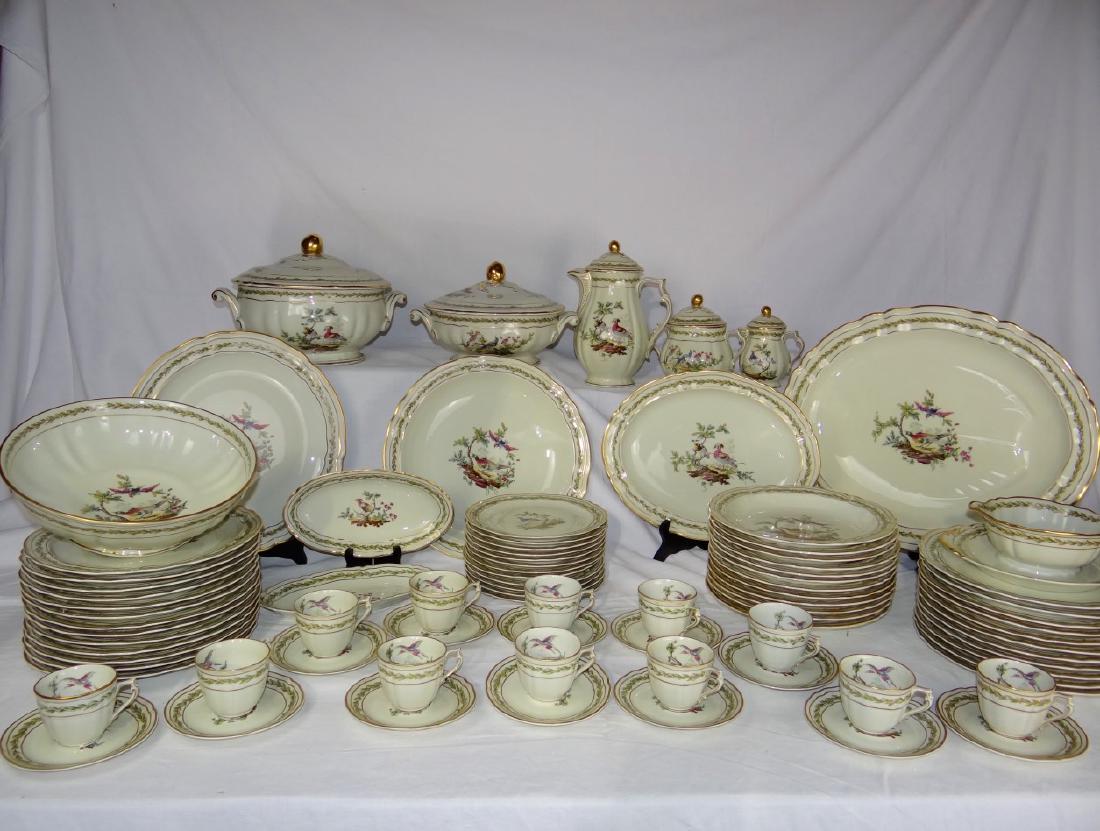85 PC. FRENCH PORCELAIN LIMOGES DINNER SERVICE: 85 PIECE FRENCH PORCELAIN "CHEVREUSE" PATTERN LIMOGES DINNER SERVICE MARKED ON REVERSE "BERNARDAUD & CIE" HAVING GOLD RIM WITH FLORAL TRELLIS BORDERS AND INDIVIDUAL CENTER RESERVES OF EXOCTIC BIRDS, C