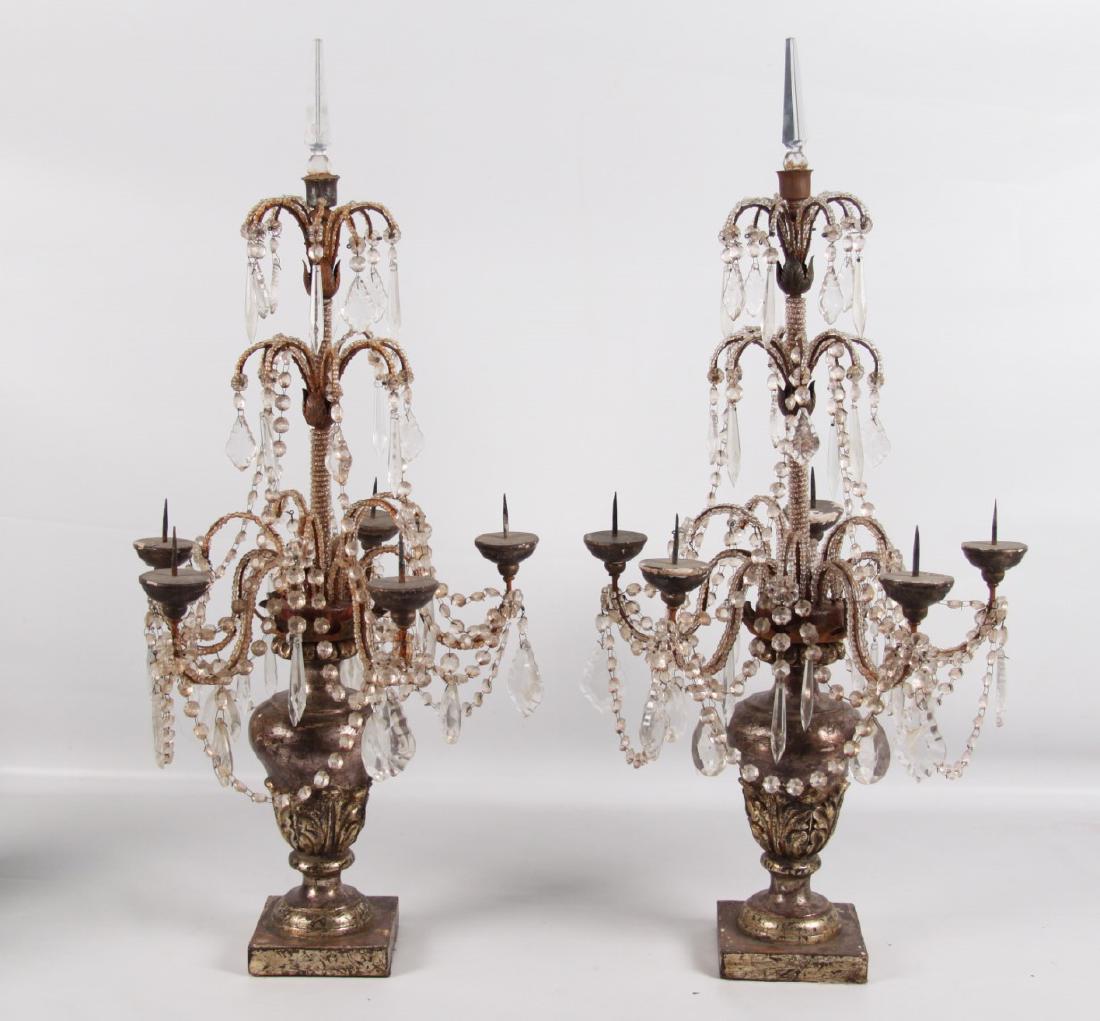 PR. OF ITALIAN POLYCHROME PRICKET CANDELABRA: PAIR OF ITALIAN SILVER POLYCHROME CARVED WOOD AND CRYSTAL 6 BRANCH PRICKET CANDELABRA WITH ANCANTHUS CARVED URN RESTING ON SQUARE CONFORMING PLINTHS, 19TH C.; 33.5"H X 17"DIA