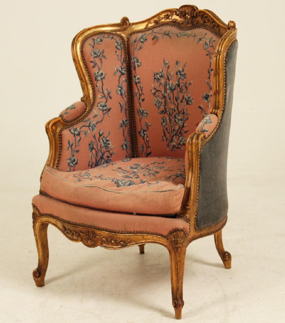 LOUIS XV STYLE PARCEL GILT NEEDLEPOINT BERGERE: NEEDLEPOINT LOUIS XV STYLE PARCEL GILT BERGERE HAVING SHELL AND ANCANTHUS SCROLL CARVED SEAT BACK RESTING ON FOLIATED CABRIOLE LEGS RESTING ON SCROLL FEET; 39.5"H X 27"W X 27"D