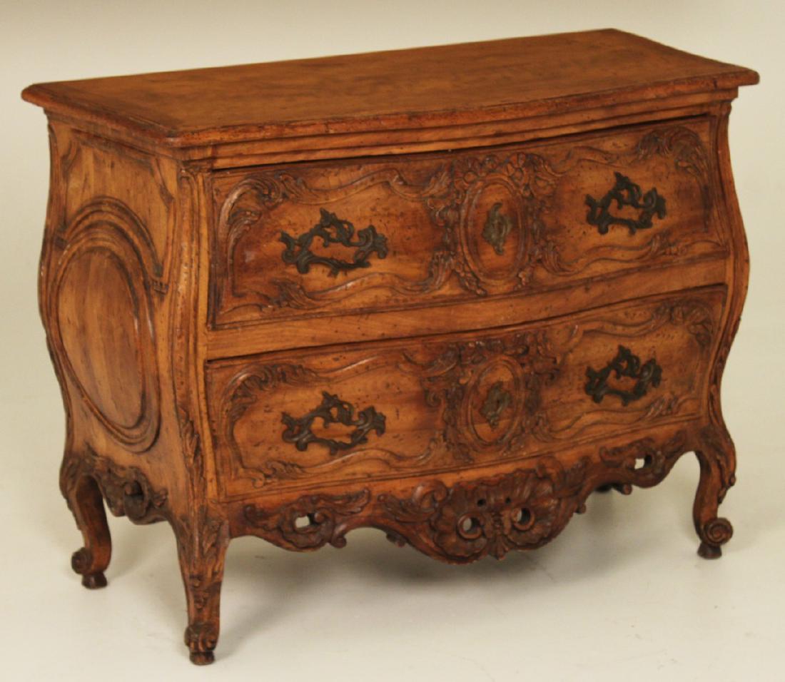LOUIS XV STYLE FRUITWOOD COMMODE: LOUIS XV STYLE FRUITWOOD COMMODE HAVING OGEE MOLDED EDGE TOP OVER RIBBON & ANCANTHUS SCROLL CARVED DEEP DRAWERS OVER A COMPLIMENTARY TREATED APRON RESTING ON CABRIOLE LEGS AND SCROLL FEET (POSSIBLY A 