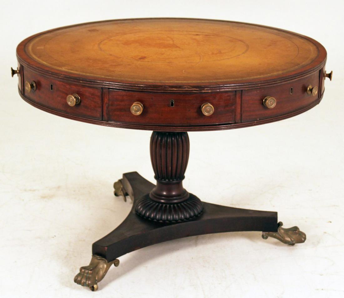 19TH C. ENGLISH REGENCY MAHOGANY RENT TABLE: ENGLISH REGENCY MAHOGANY RENT TABLE HAVING GOLD TOOLED LEATHER TOP OVER A REEDED MOLDED EDGE TOP WITH ALTERNATING DRAWERS RESTING ON CLASSICAL URN CARVED PEDESTAL WITH TRIFID FORMED PLATFORM AND BRONZ