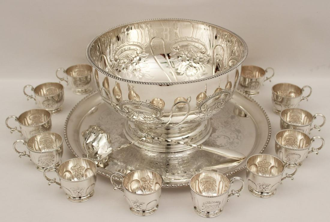 15 PIECE ENGLISH SILVER PLATED EMBOSSED PUNCH BOWL SET: 15 PIECE ENGLISH SILVER PLATED EMBOSSED PUNCH BOWL SET CONSISTING OF PUNCH BOWL, LADLE, 12 CUPS, AND MATCHING TRAY (WILLIAM ADAMS INC BIRMINGHAM ENGLAND); 9"H X 14.5"DIA. BOWL; PROPERTY OF THE ESTATE