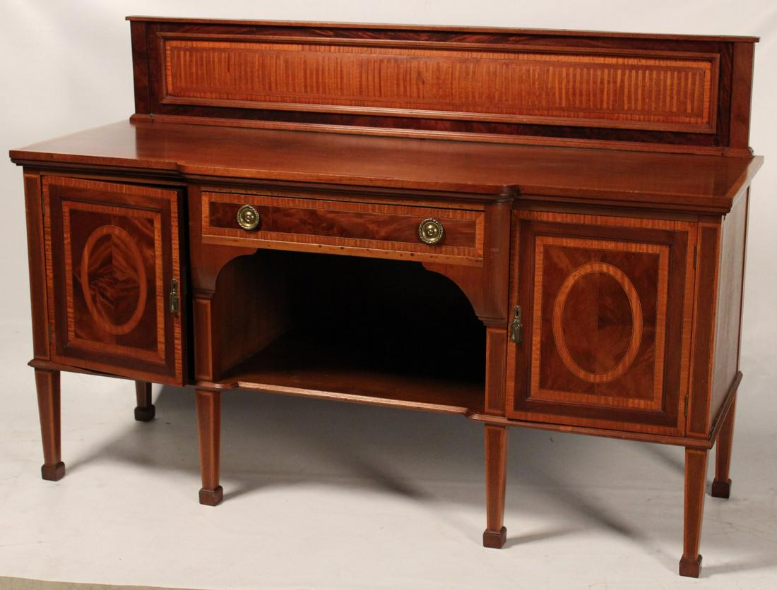 HEPPLEWHITE STYLE MAHOGANY SIDEBOARD: HEPPLEWHITE STYLE MAHOGANY SIDEBOARD HAVING FLUTED SATINWOOD BACKRAIL AND CROSSBANDED TOP OVER ONE DRAWER AND TWO HINGED CABINET DOORS WITH OPEN CAVITY RESTING ON TAPERD LEGS AND SPADE FEET; 49"H X 72