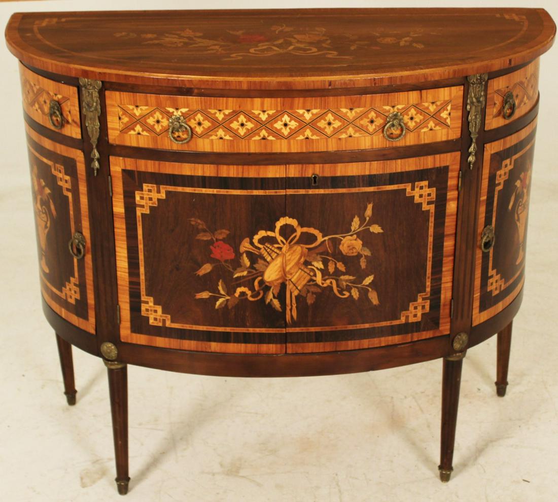 CONTINENTAL INLAID DEMI'LUNE COMMODE, 19TH C.: CONTINENTAL MARQUETRY INLAID TULIPWOOD AND ROSEWOOD DEMI-LUNE COMMODE HAVING 3 DRAWERS OVER 4 CUPBOARD DOORS ON TAPERD LEGS WITH BRONZE SABOTS, 19TH C.; 36"H X 43"W X 19"D