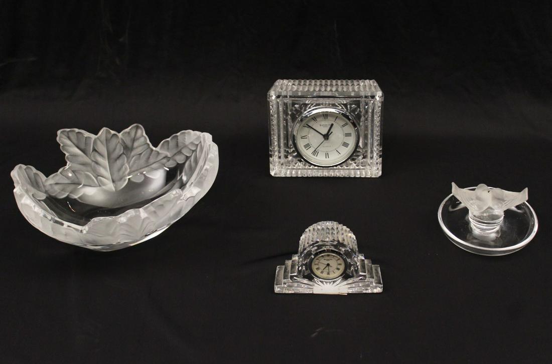 4 PC. LOT OF SIGNED LALIQUE AND WATERFORD: 4 PIECE MISCELLANEOUS LOT OF SIGNED LALIQUE AND WATERFORD CONSISTING OF A LALIQUE LEAF SHAPED BOWL AND LOVE BIRD MOUNTED DISH; ALONG WITH 2 WATERFORD CLOCKS; 4"H X 8"W X 6"D LALIQUE LEAF SHAPED BOWL