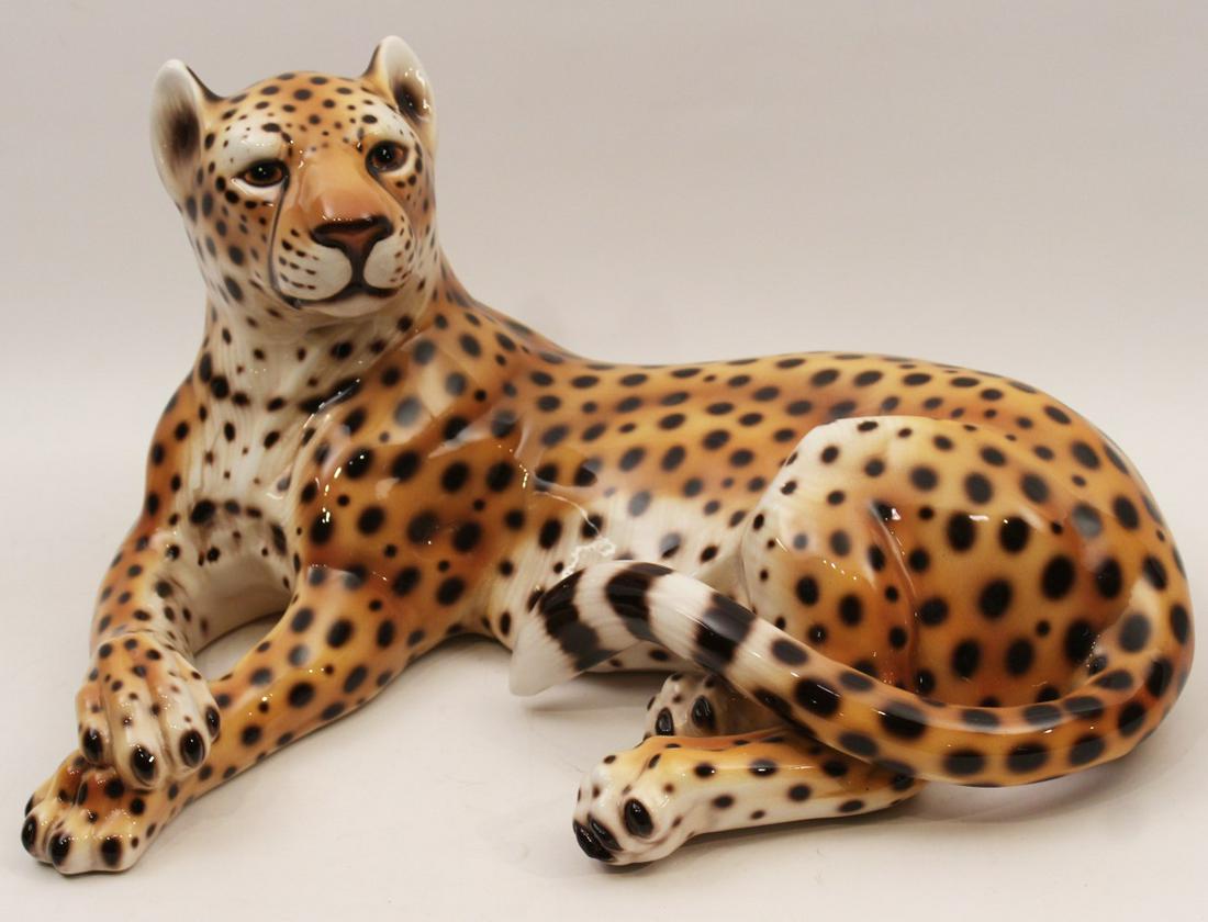 ITALIAN CERAMIC FIGURE OF RECLINING LEOPARD: FIRED CERAMIC FIGURE OF RECLINING LEOPARD MADE IN ITALY; 12"H X 21"W X 15.5"D