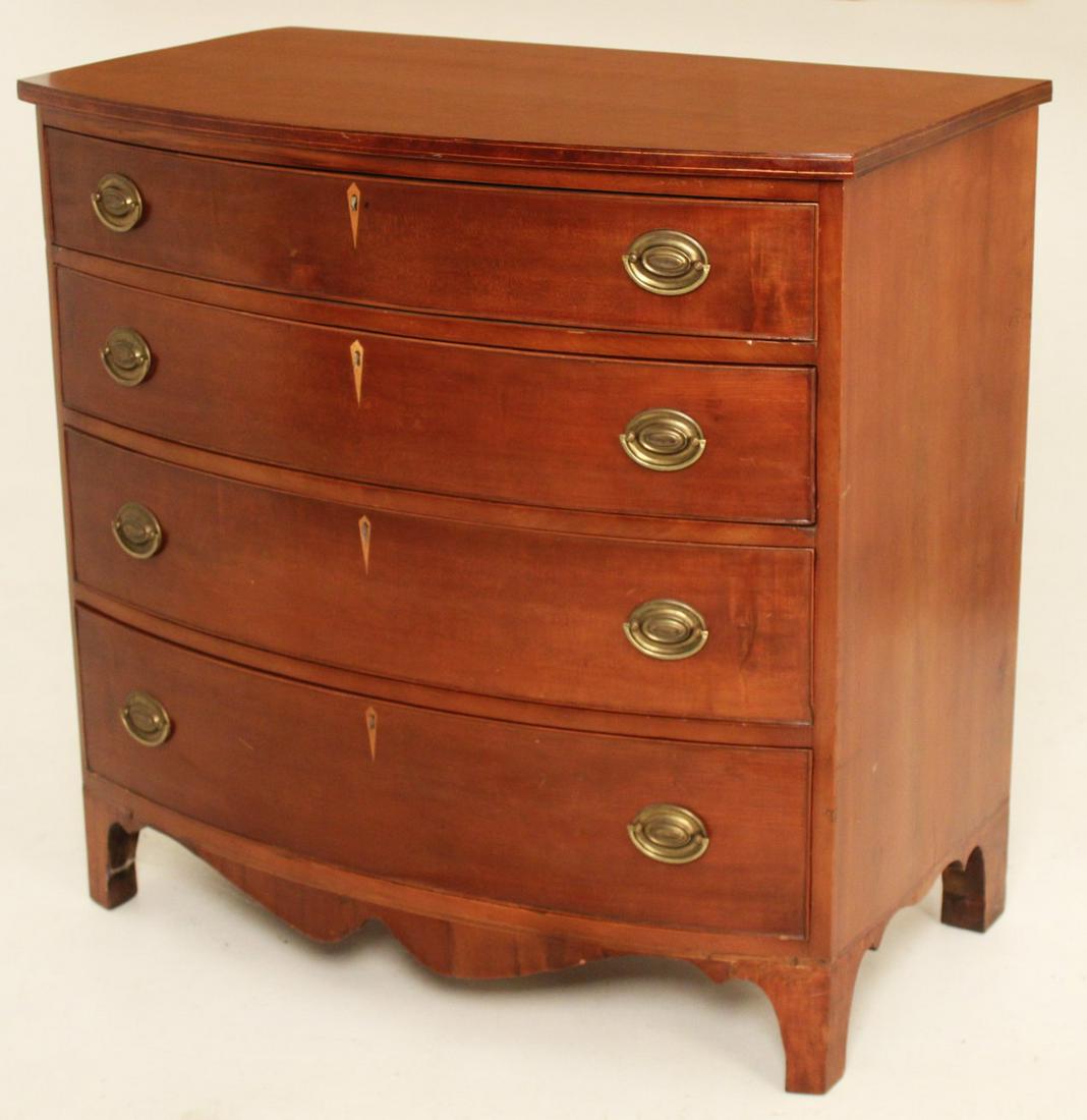 EARLY 19TH C. AMERICAN CHERRY BOWFRONT CHEST: AMERICAN CHERRY BOWFRONT CHEST HAVING STRING INLAID TOP OVER 4 GRADUATING DRAWERS WITH DIAMOND BOXWOOD INLAID ESCUTCHEONS WITH SCALLOP APRON RESTING ON SPLAY FEET, EARLY 19TH C.; 37"H X 38"W X 22"D