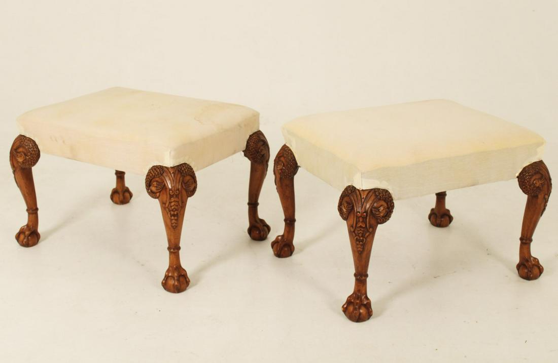 PR OF CHIPPENDALE STYLE MAHOGANY STOOLS WITH HOHO BIRD: PAIR OF CHIPPENDALE STYLE MAHOGANY STOOLS HAVING "C" SCROLL AND HOO HOO BIRD CARVED KNEES WITH ANKLE RINGS RESTING ON BALL AND CLAW FEET; 18"H X 30"W X 26"D; CONDITION: ONE WITH STAINING TO FABRIC
