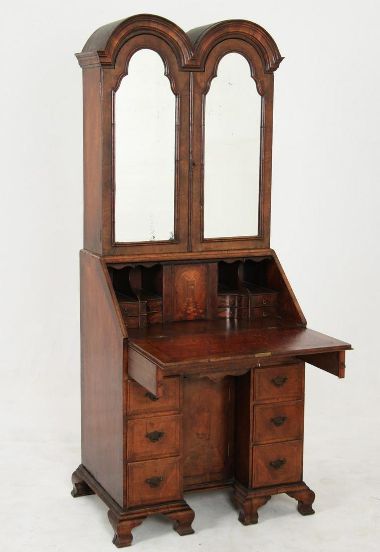 GEORGE III STYLE WALNUT BUREAU BOOKCASE: GEORGE III STYLE ENGLISH KNEEHOLE WALNUT DOUBLE BONNET MIRROR DOOR BUREAU BOOKCASE HAVING INLAID SHAPED INTERIOR ON OGEE BRACKET FEET, 19TH C; 79"H X 30"W X 21"D