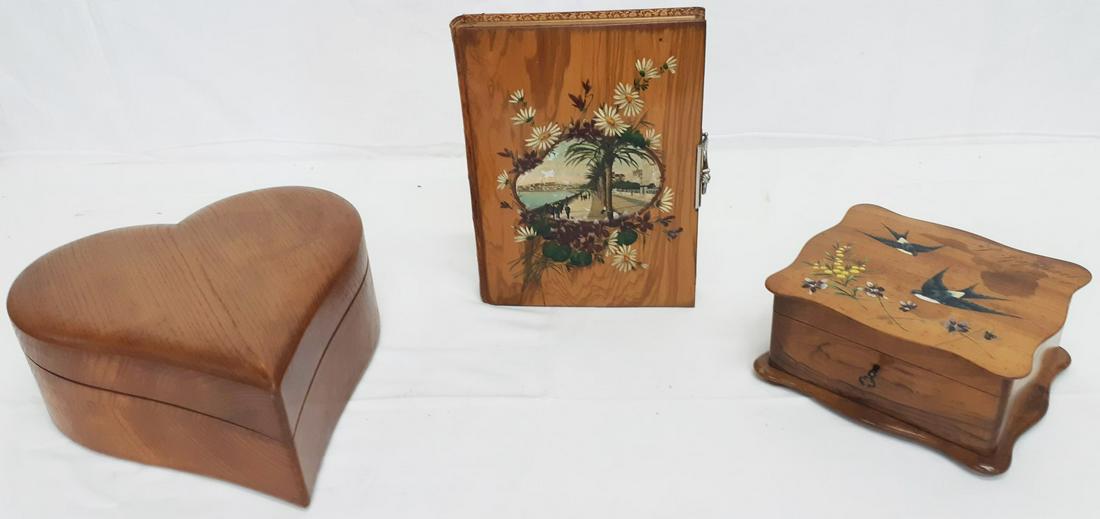 2 WALNUT BOXES & LEATHER BOUND PHOTO ALBUM: 3 PIECE MISC. LOT CONSISTING OF 2 HANDPAINTED WALNUT BOXES, ONE JEWELRY BOX SIGNED L. RAPHAEL, THE OTHER A TWO PART HEART SHAPED BOX; ALONG WITH A LEATHER BOUND PHOTO ALBUM; 11"H X 8.5"W PHOTO ALBUM