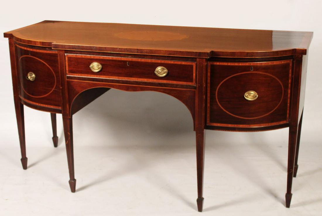 ENGLISH HEPPLEWHITE MAHOGANY SIDEBOARD: ENGLISH HEPPLEWHITE MAHOGANY SIDEBOARD HAVING CROSSBANDED TOP WITH FAN INLAY OVER ON RECTANGULAR AND DEEP WINE DRAWER, THE OTHER A SWING DOOR, RESTING ON STRING INLAID TAPERD LEGS ON SPADE FEET, 19TH 
