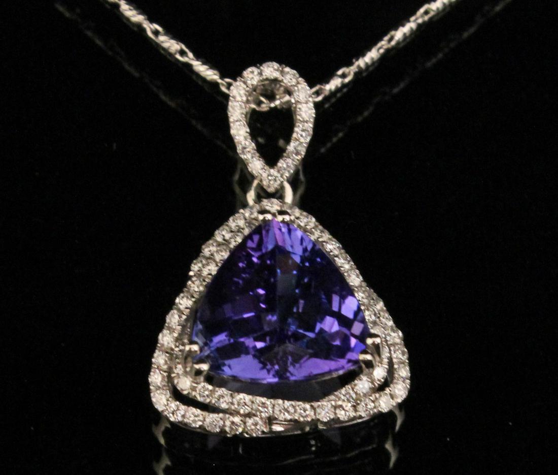 14K WG DIAMOND AND TANZANITE NECKLACE: 14K WHITE GOLD DIAMOND AND TANZANITE PENDANT NECKLACE HAVING TANZANITE CENTER TRIANGULAR STONE WEIGHING APPROX. 4.33 CT, 10.8 X 10.4 X 6.3 MM; DIAMONDS 0.44 CTW; CHAIN 18"; 5.3 GRAMS TOTAL WEIGHT