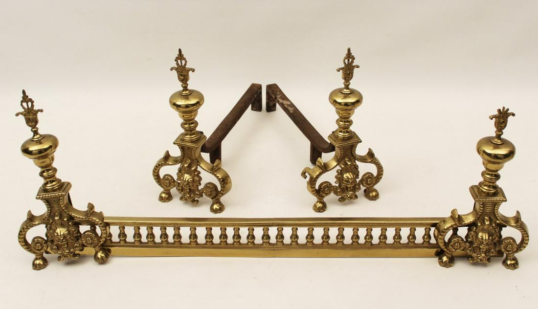 FRENCH 5 PC. GILT BRONZE FIREPLACE SET: FRENCH 5 PIECE GILT BRONZE FIREPLACE SET CONSISTING OF LION HEAD CHENETS AND MATCHING ANDIRONS; 11"H X 31"W