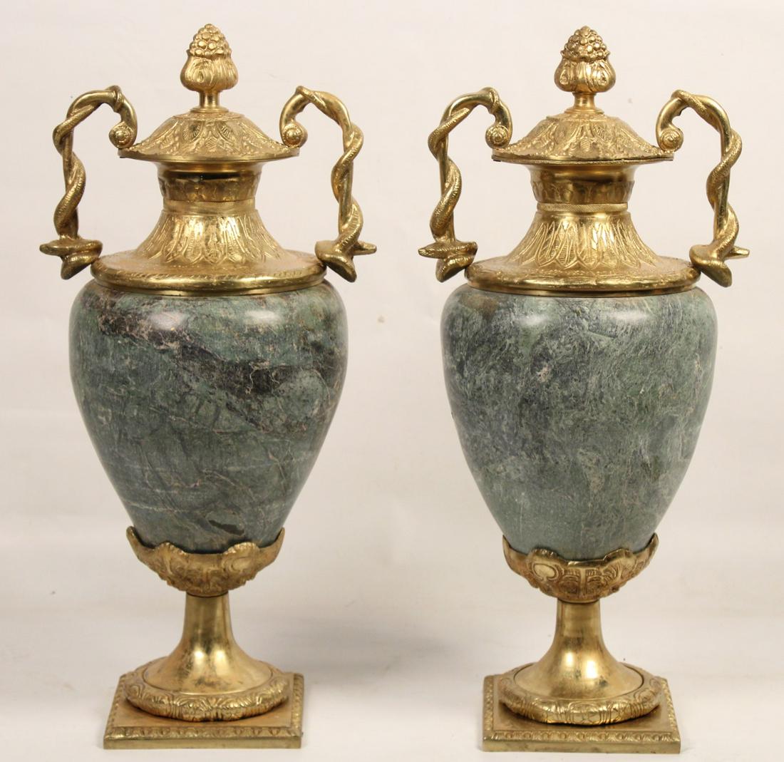PR. OF GRAND MARBLE URNS W/ SERPENT HANDLES: PAIR OF GRAND MARBLE URNS HAVING ENRICHED BRONZE CAPS WITH TWISTED SERPENT HANDLES RESTING ON CONFORMING RAISED TRUMPET FORMED PEDESTAL BASE; 27"H X 12"W