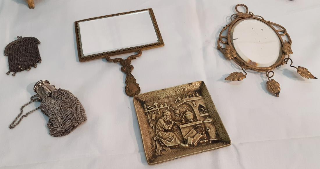 8 DECORATIVE OBJECTS: 8 DECORATIVE OBJECTS; CONTENTS FROM FRENCH CHALET CONSISTING OF ART DECO INKWELL, GILT METAL AND CRYSTAL FOOTED VANITY BOX, CASED TRAVEL CLOCK, 2 VANITY MIRRORS, 2 PURSES, BRONZE EMBOSSED PLAQUE; 3.5"