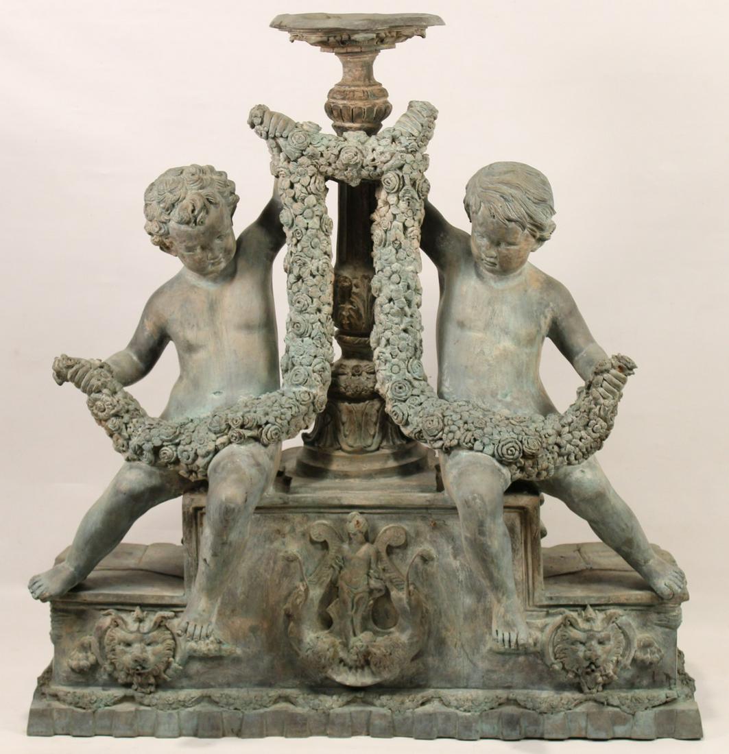 ITALIAN STYLE VERDE BRONZE WATER FOUNTAIN: ITALIAN STYLE VERDE BRONZE FOUNTAIN WITH STEPPED PEDESTAL WATER FOUNTAIN SURROUNDED WITH SEATING PUTTI FIGURES HOLDING FESTOON OF FLOWER PETALS, THEN EMBOSSED LIONS ON WALL WITH WATER FEATURE ALSO; 53
