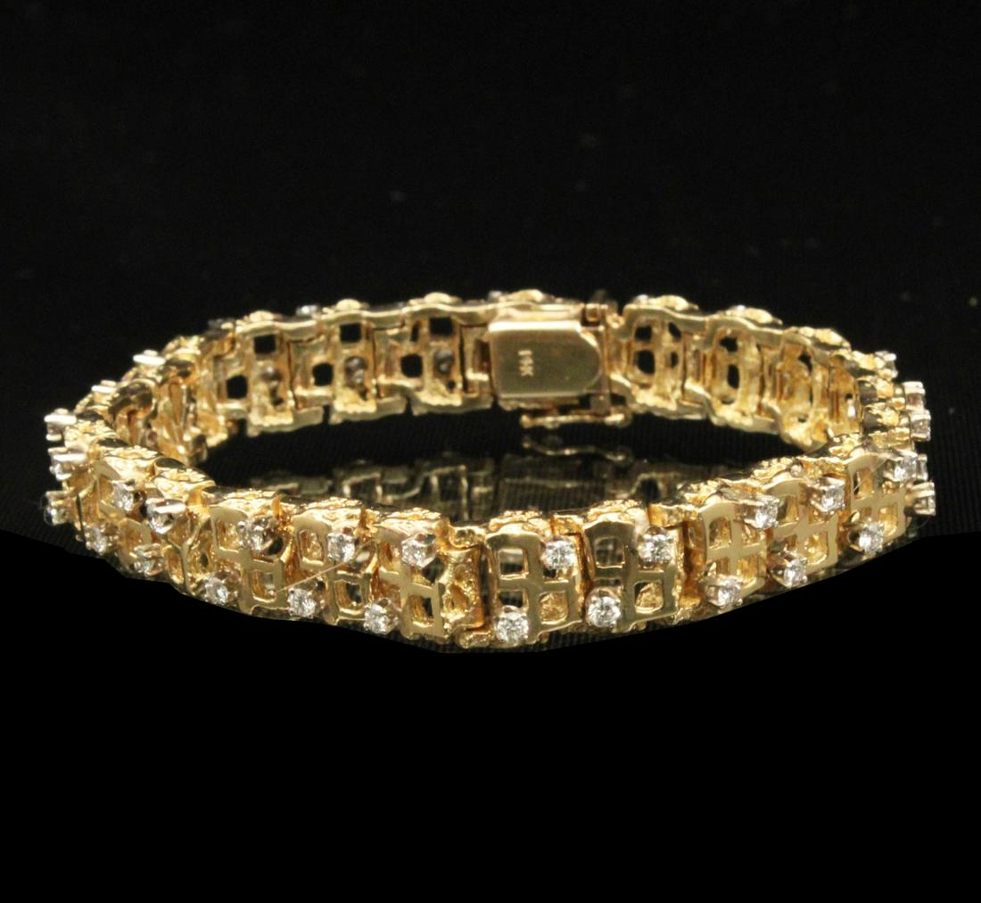 14K YELLOW GOLD AND DIAMOND BRACELET; 31.6 GR: 14K YELLOW GOLD AND DIAMOND 7" BRACELET; APPROX. 1.25 CTW DIAMONDS; 10MM WIDE; 31.6 GRAMS TOTAL WEIGHT