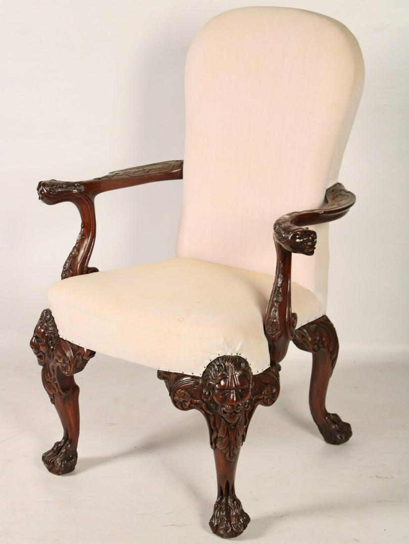 IRISH CHIPPENDALE STYLE ARM CHAIR: IRISH CHIPPENDALE STYLE ARM CHAIR HAVING LION HEAD CARVED ARMS AND KNEES RESTING ON HAIRY PAW FEET